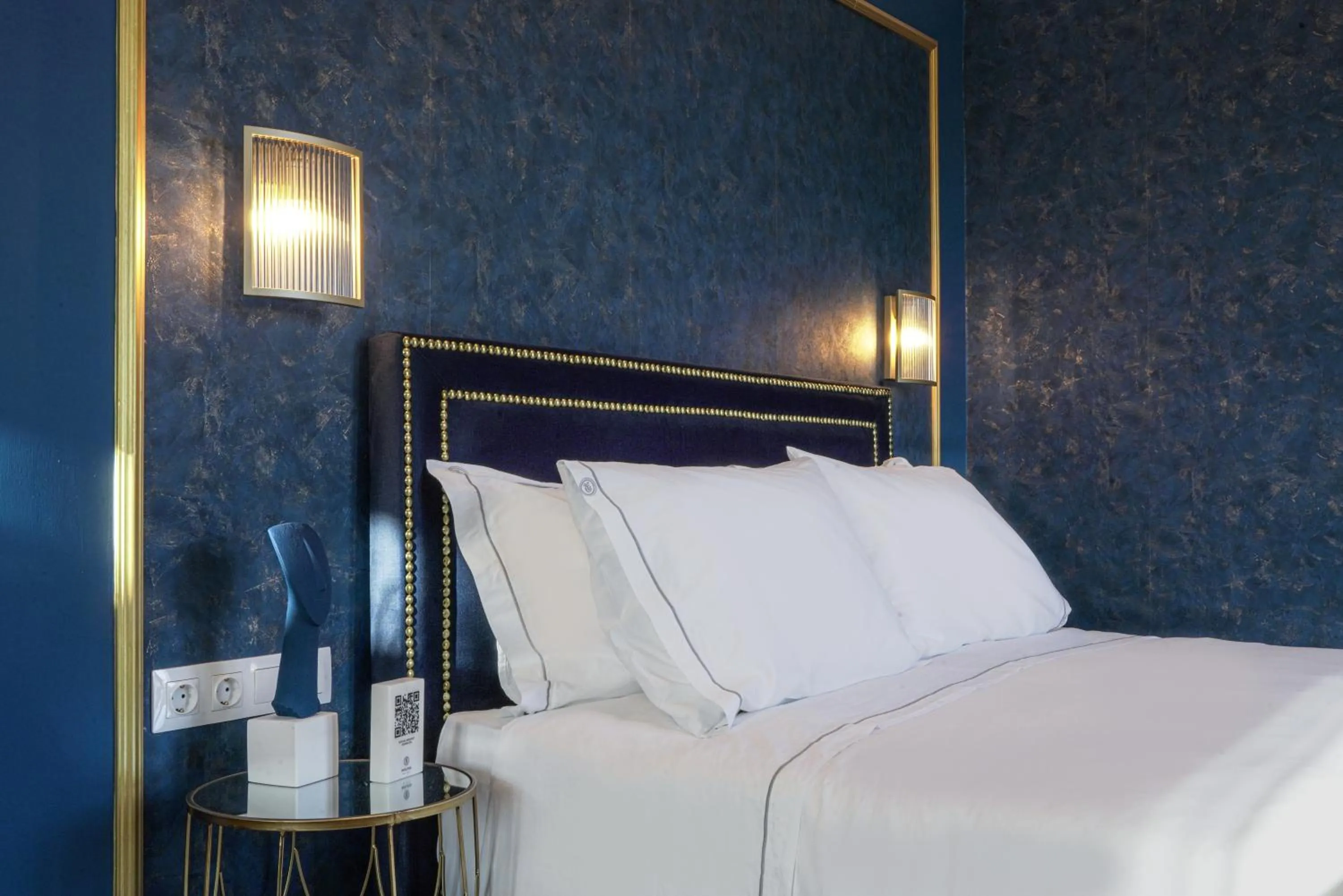 Bed in Pafsilipon Suites