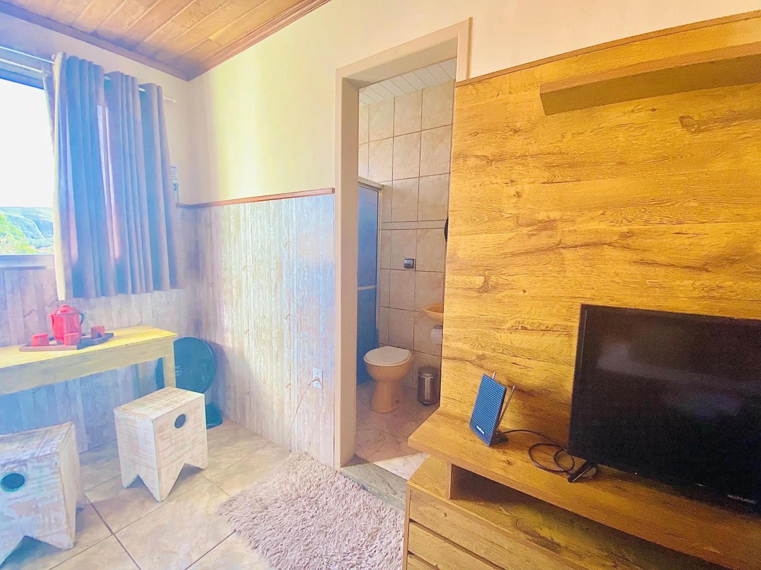 Photo of the whole room in Hospedaria Vila Rica - Pousada a 1 km do Centro Histórico