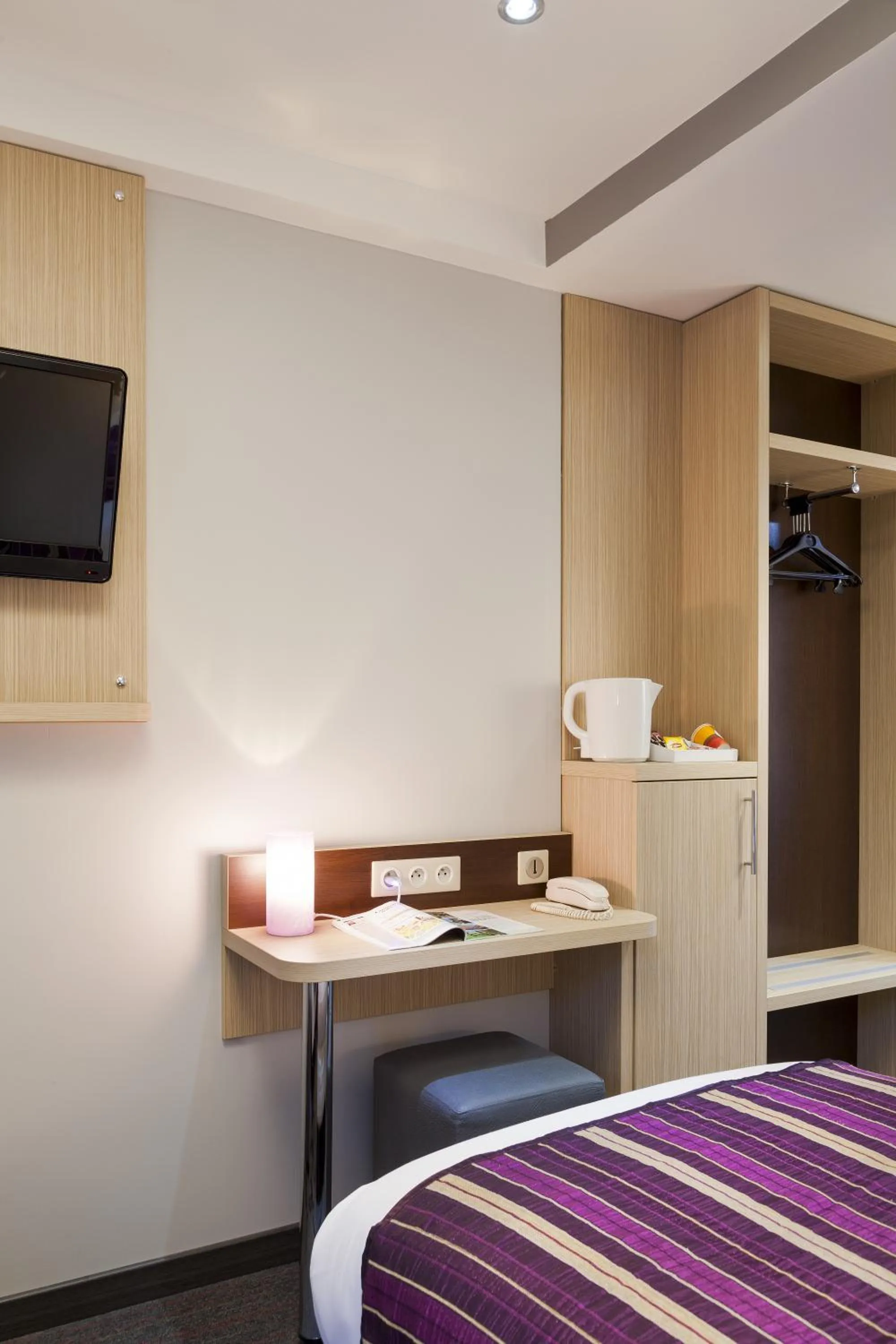 Decorative detail, Bed in FH Confort Hotel Orléans Co'met