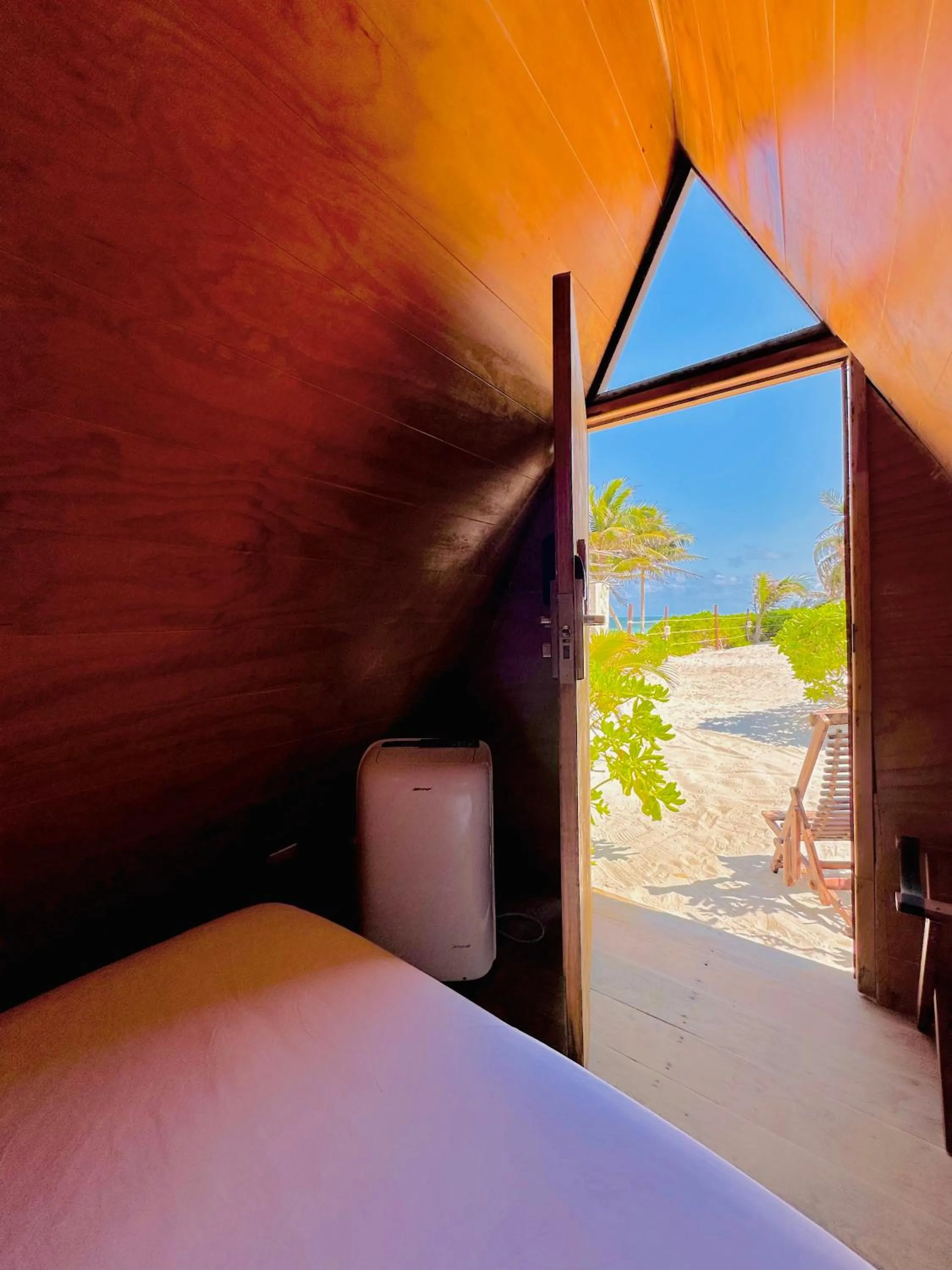 Toilet, Bed in Mia Tulum Beachfront Resort - Ocean View Suites and Beach Club