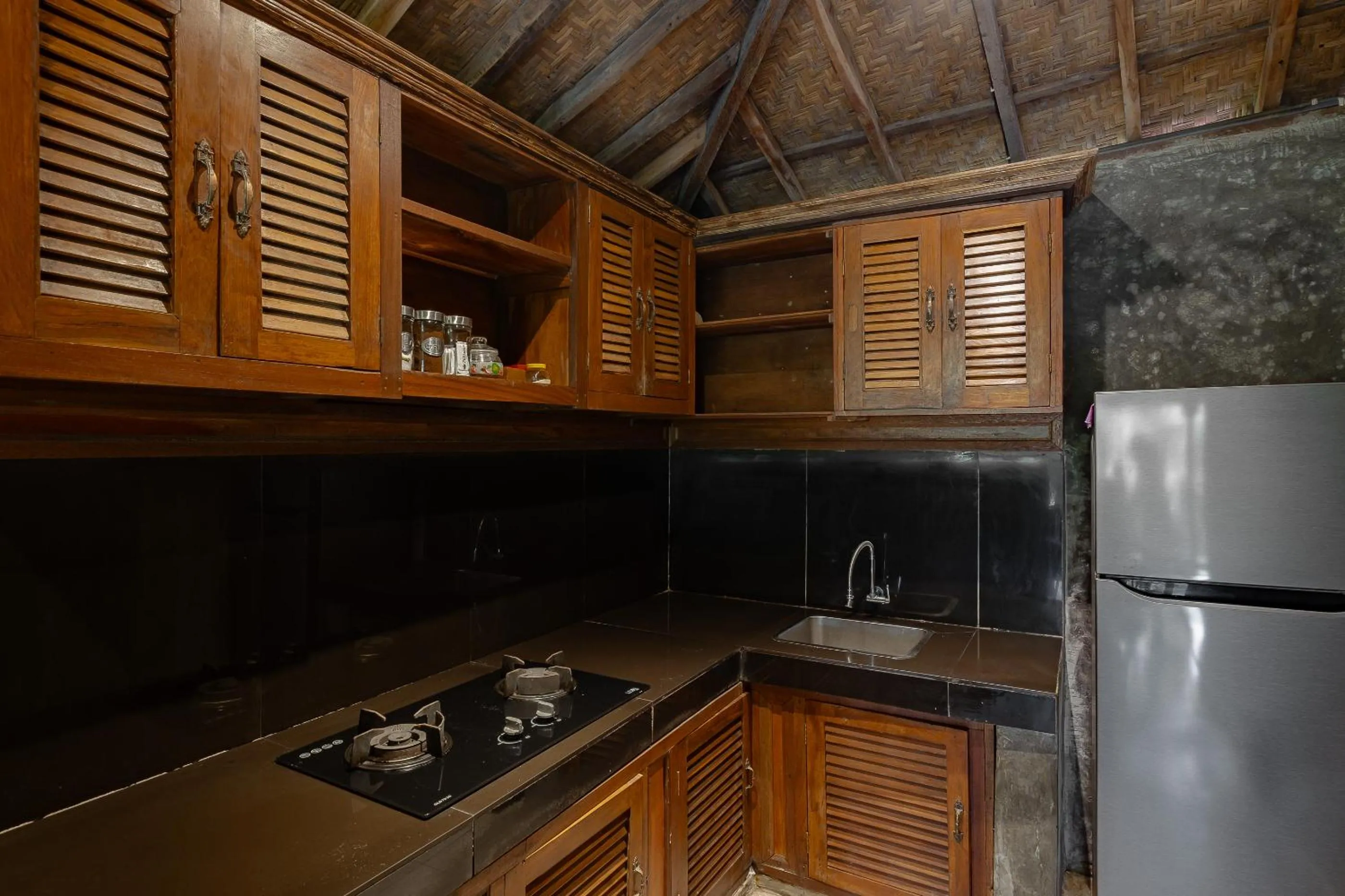 Kitchen or kitchenette in Moringa Ubud Villa