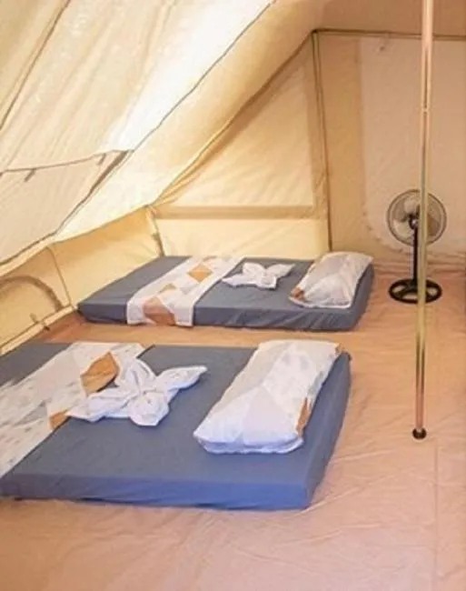 Bed in The Acacia Glamping Park