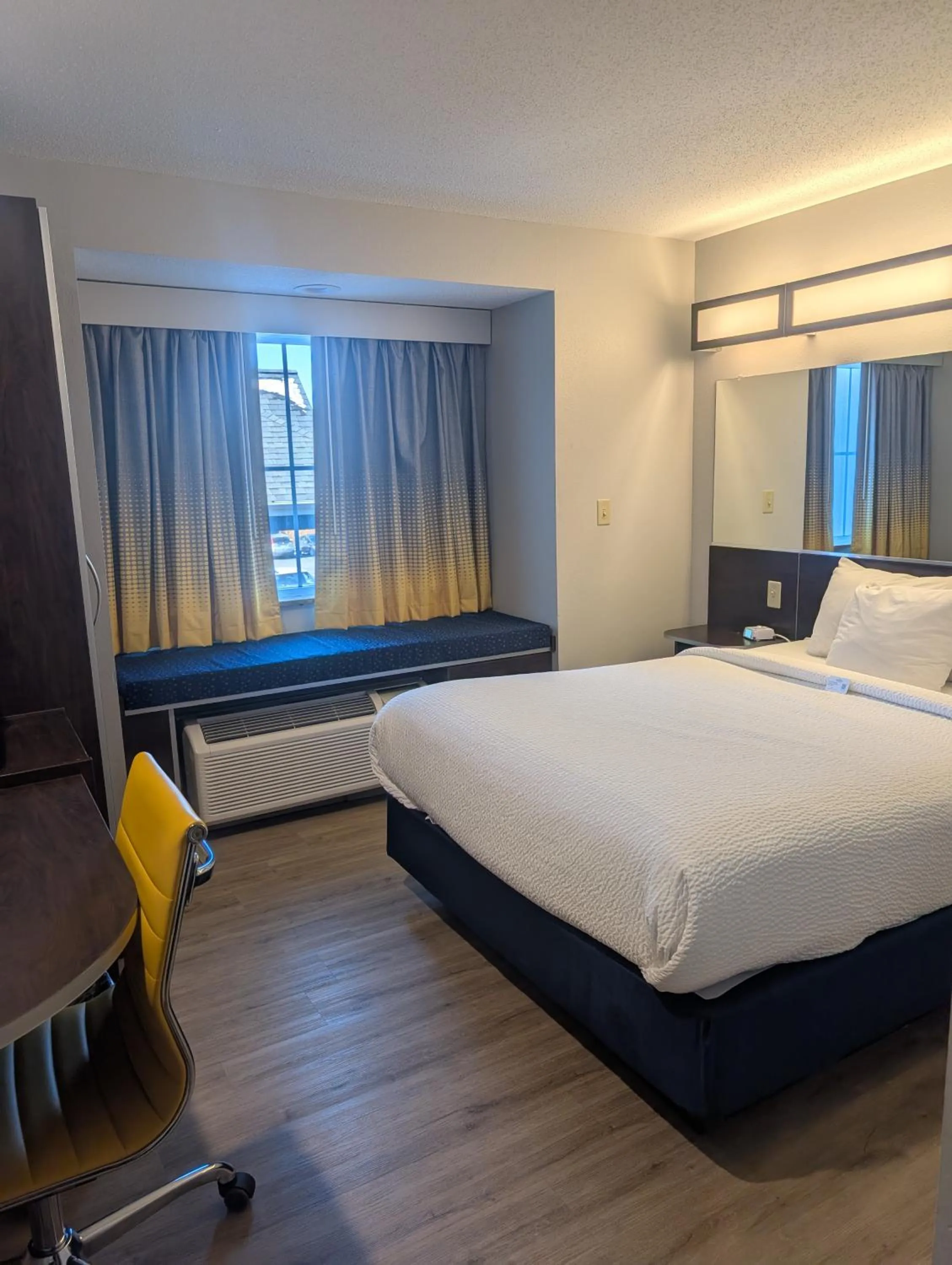 Bed in Microtel Inn & Suites by Wyndham Wheeling at The Highlands