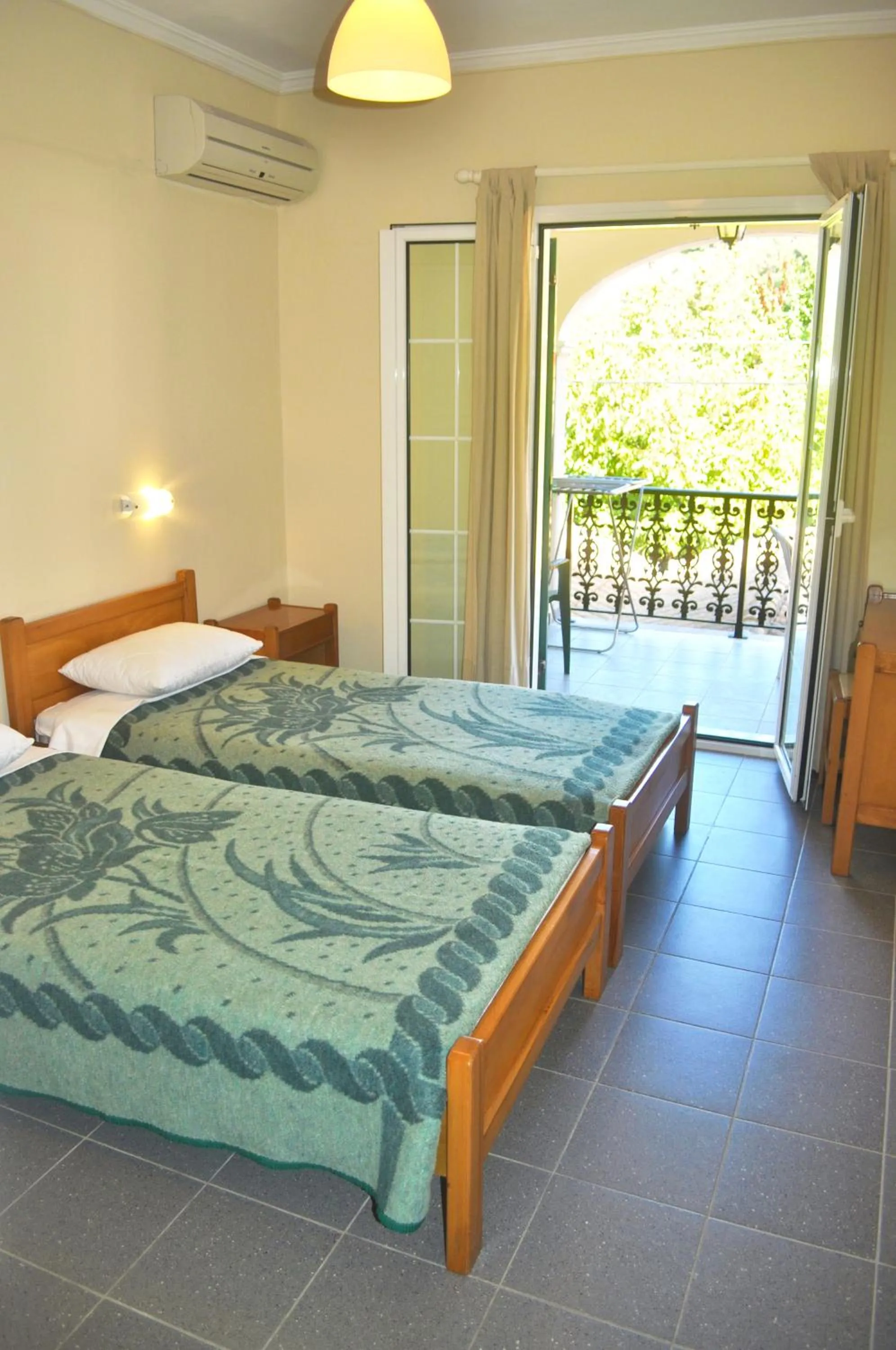 Bedroom, Bed in Holiday Apartments yannis on Agios Gordios beach in Corfu