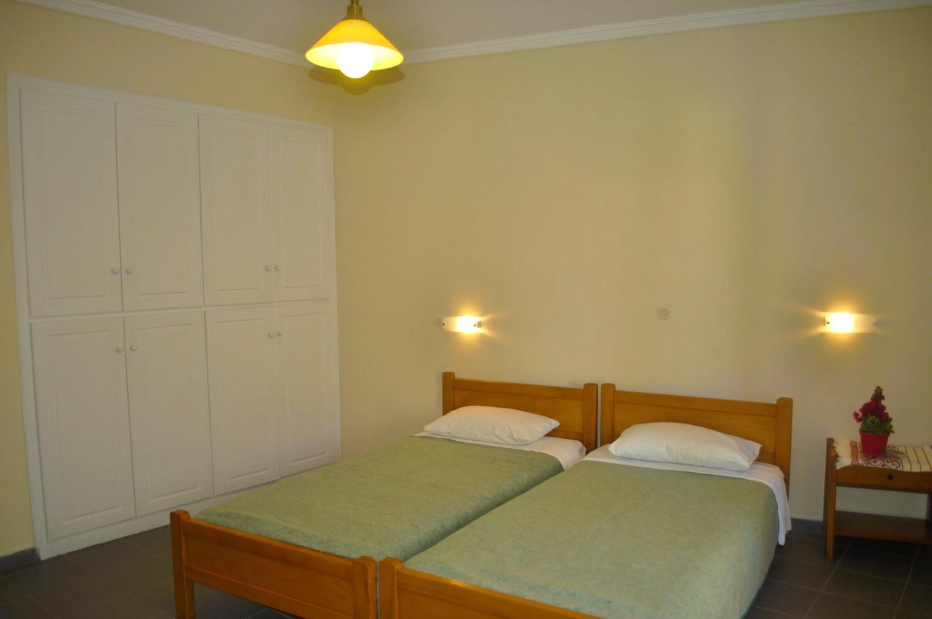 Bedroom, Bed in Holiday Apartments yannis on Agios Gordios beach in Corfu