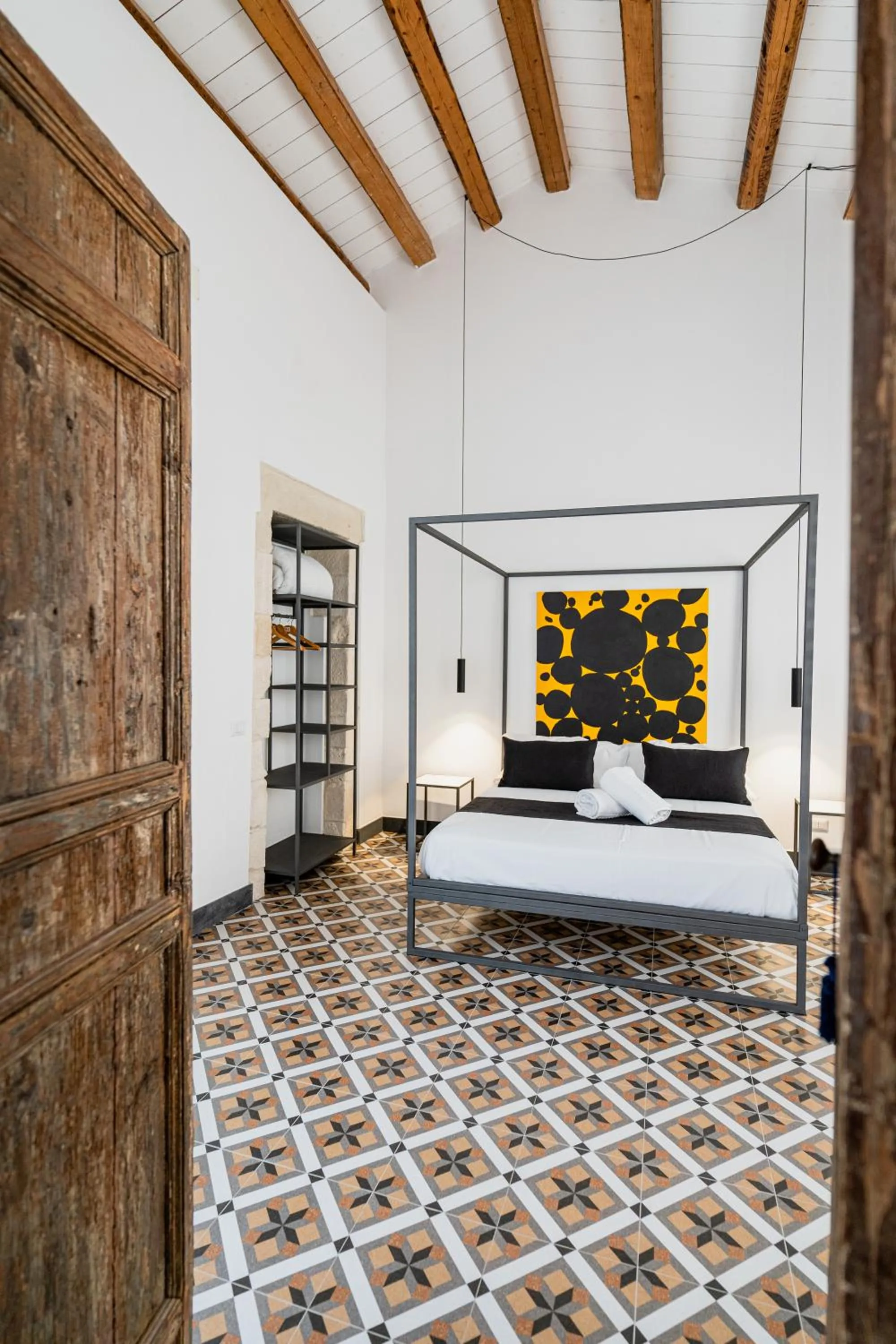 Bed in Isabella di Castiglia Apartments