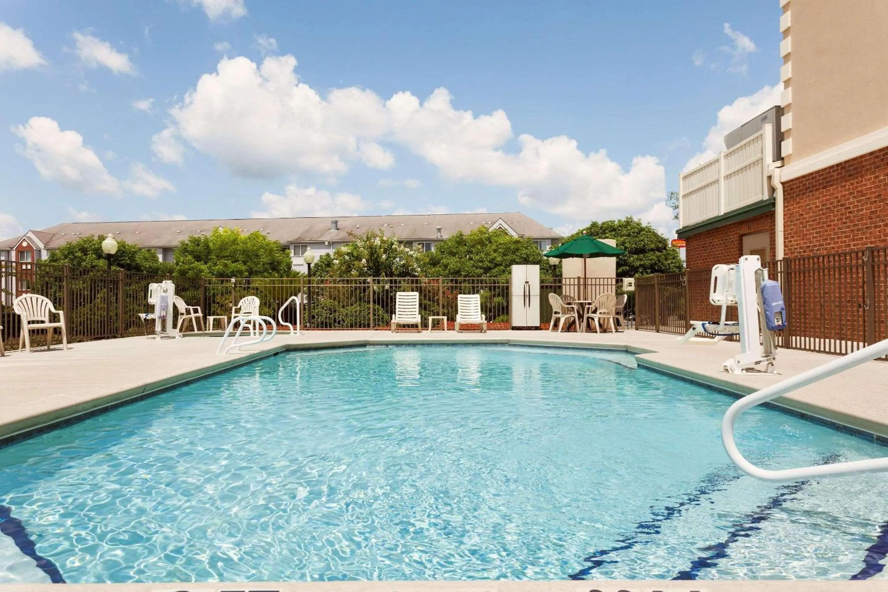 Swimming pool in Country Inn & Suites by Radisson, Tifton, GA