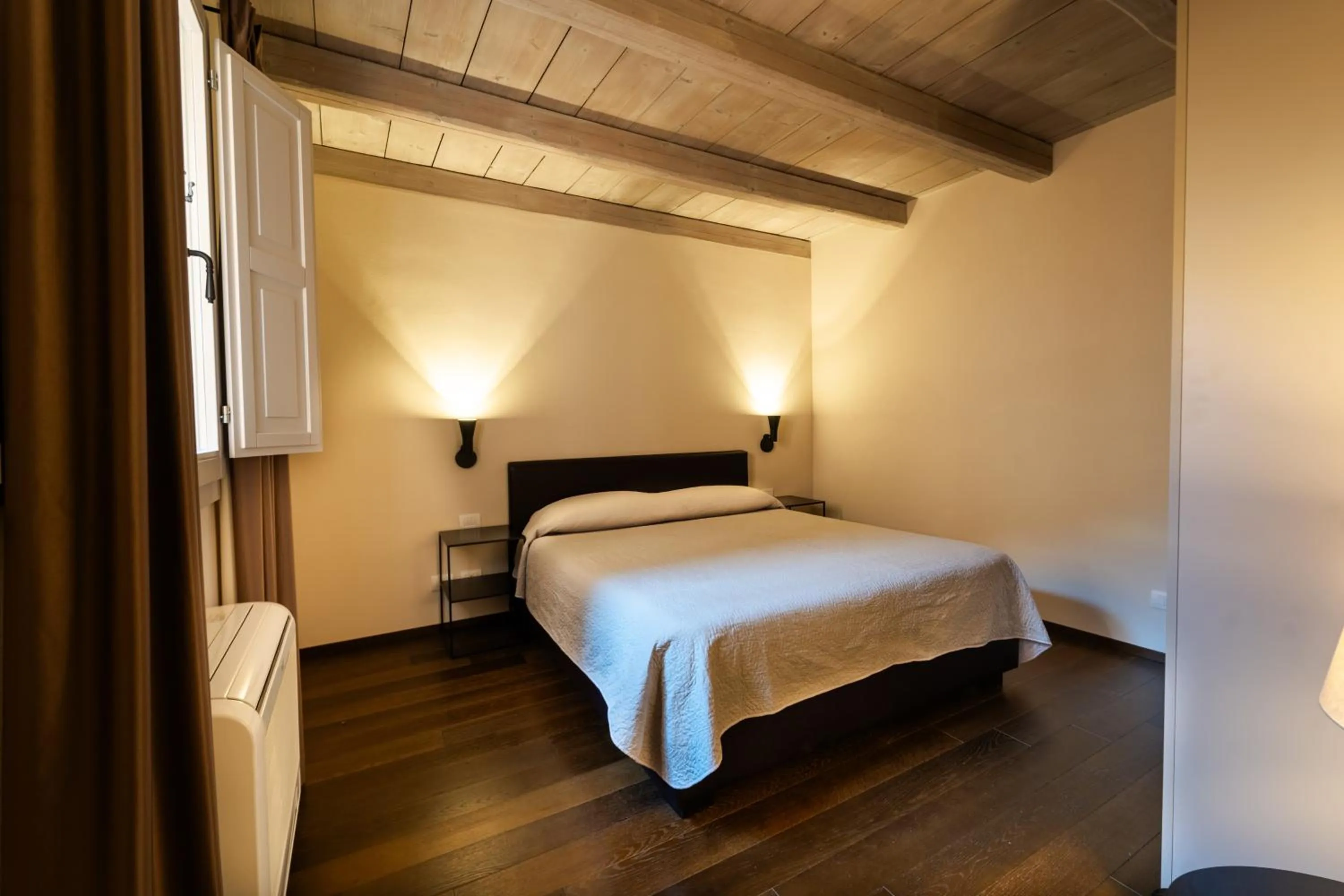 Bed in PALAZZO DE' ROSSI HOTEL