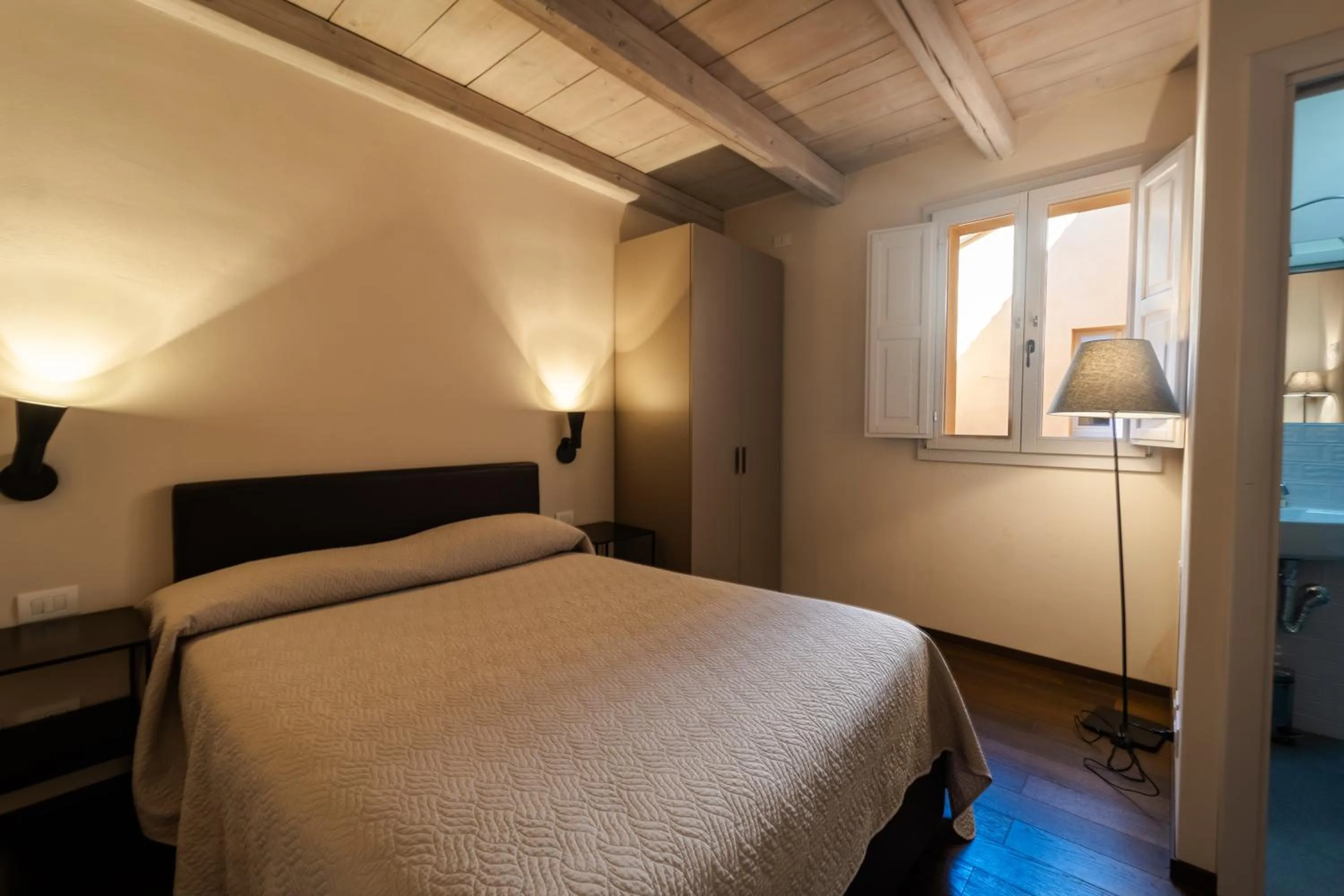 Bed in PALAZZO DE' ROSSI HOTEL