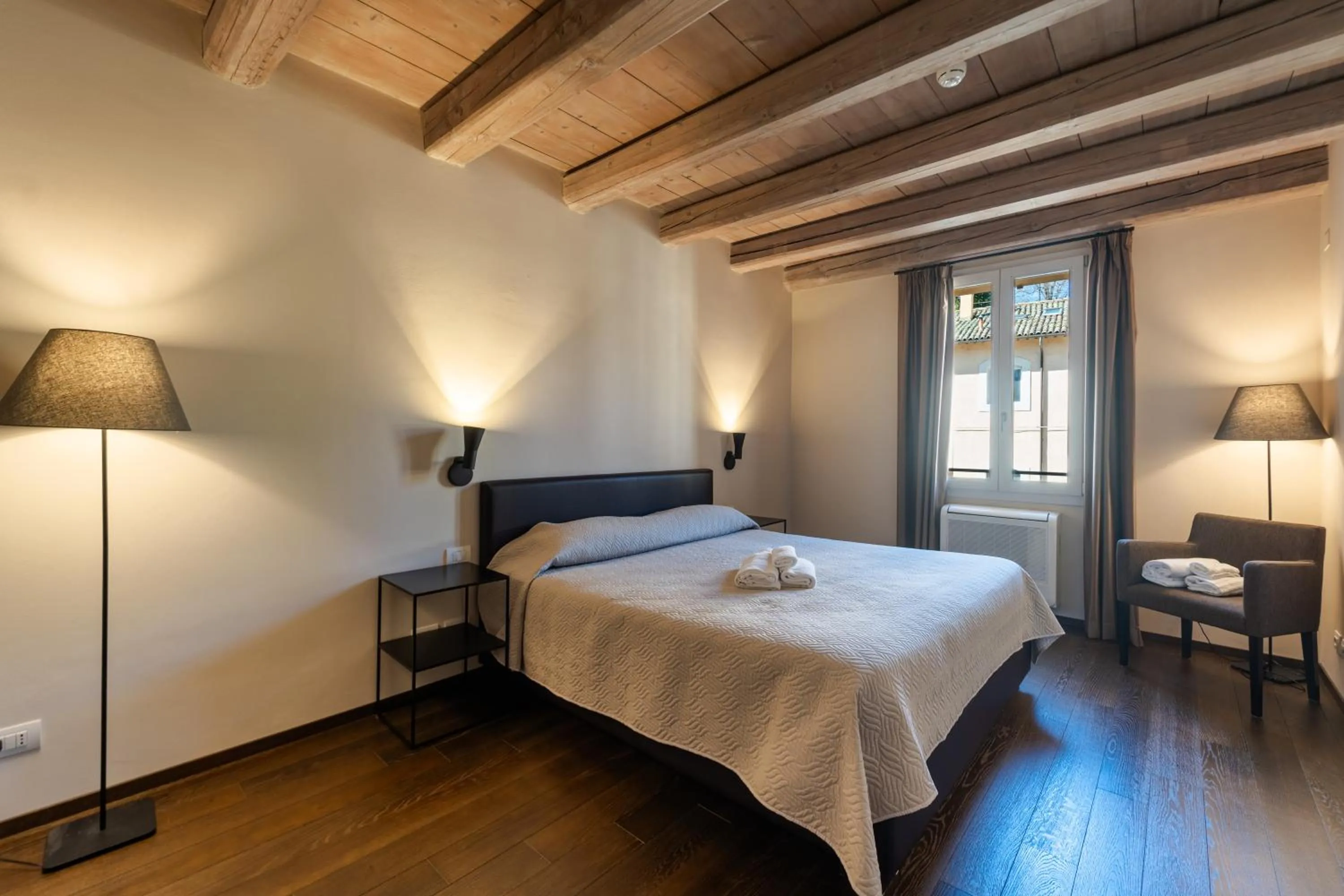 Bed in PALAZZO DE' ROSSI HOTEL