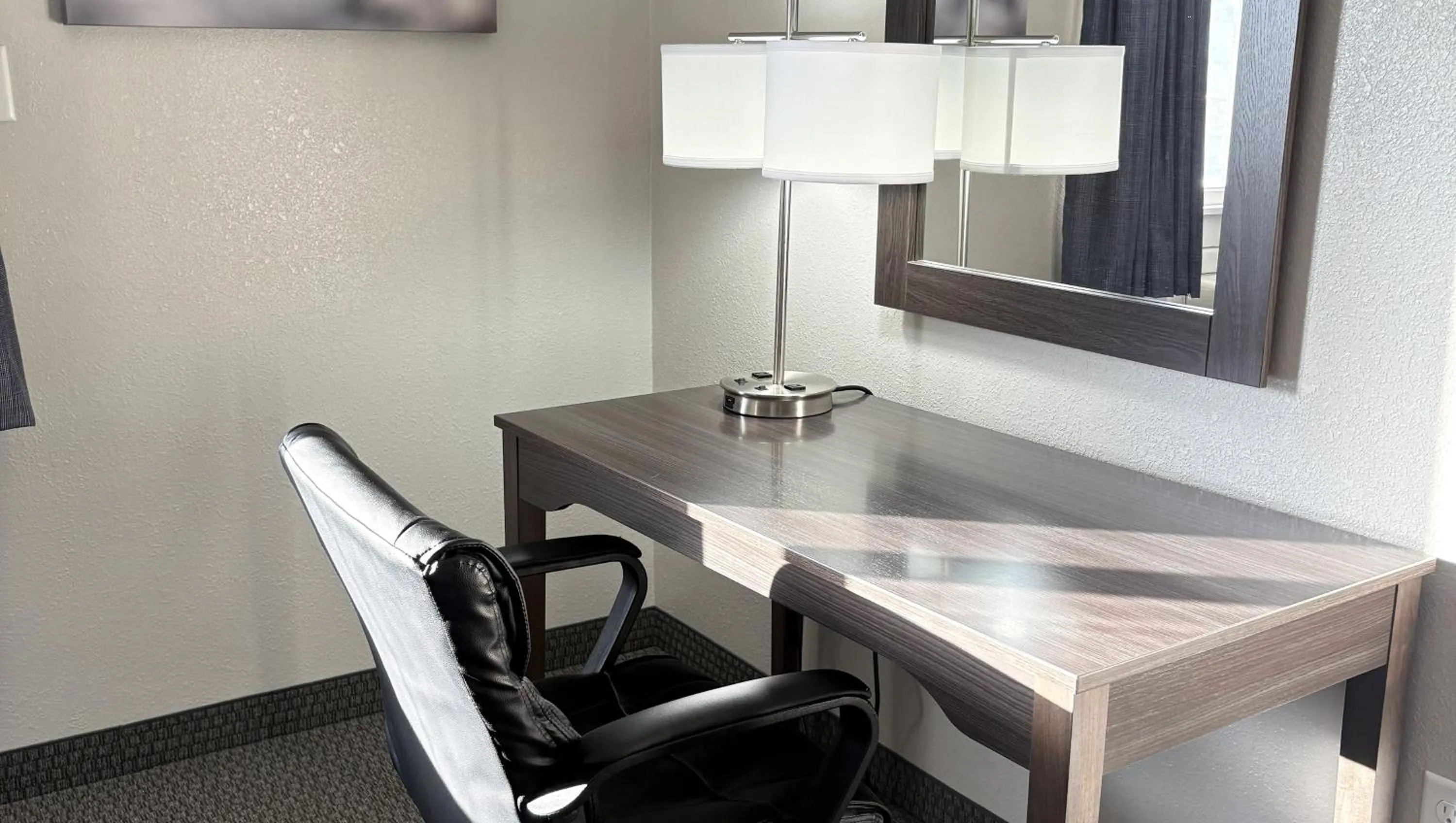 Bedroom in Magnuson Grand Pioneer Inn and Suites