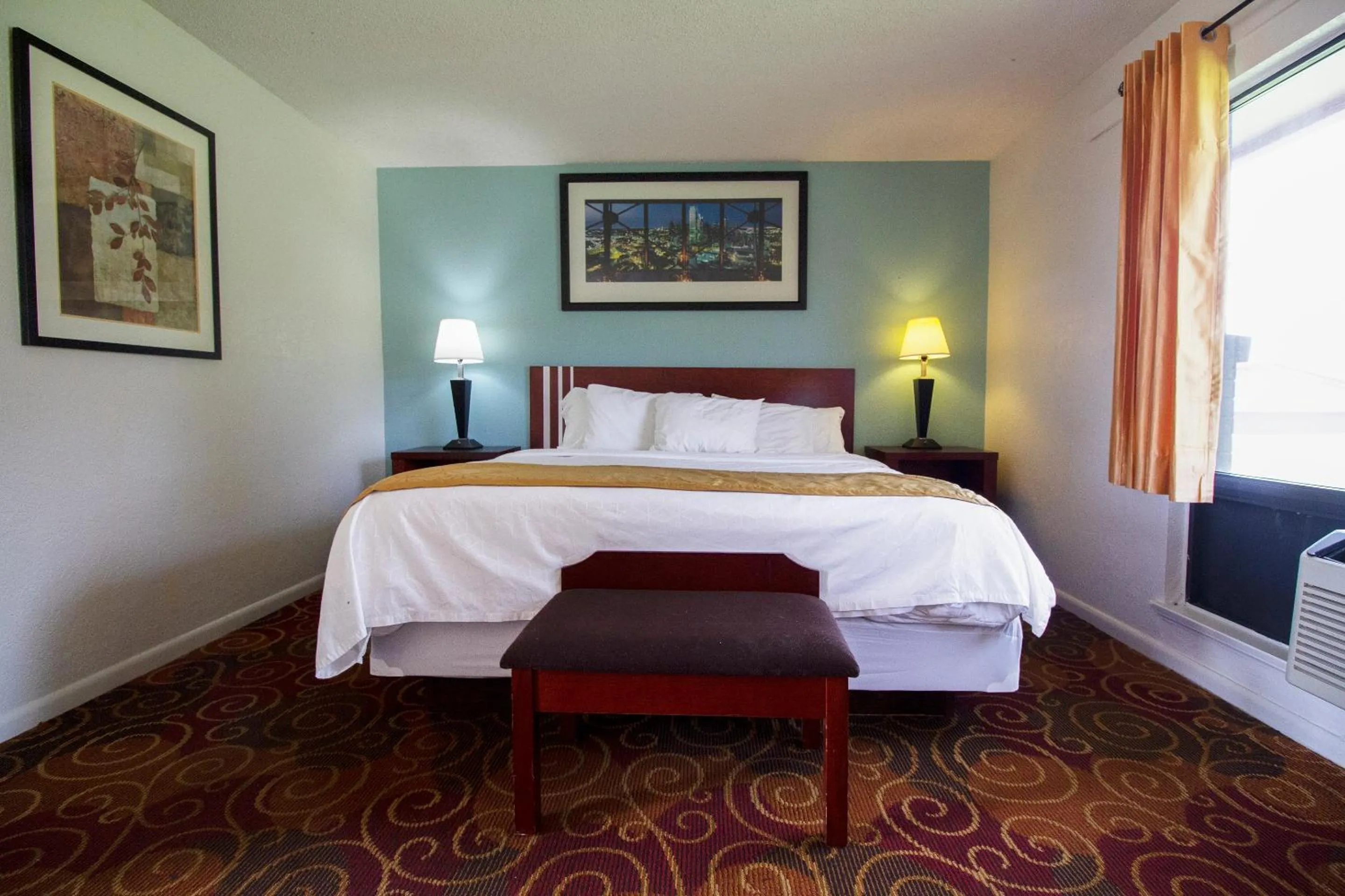 Bedroom in American Best Inn By OYO I-35 Perry near Lake McMurtry