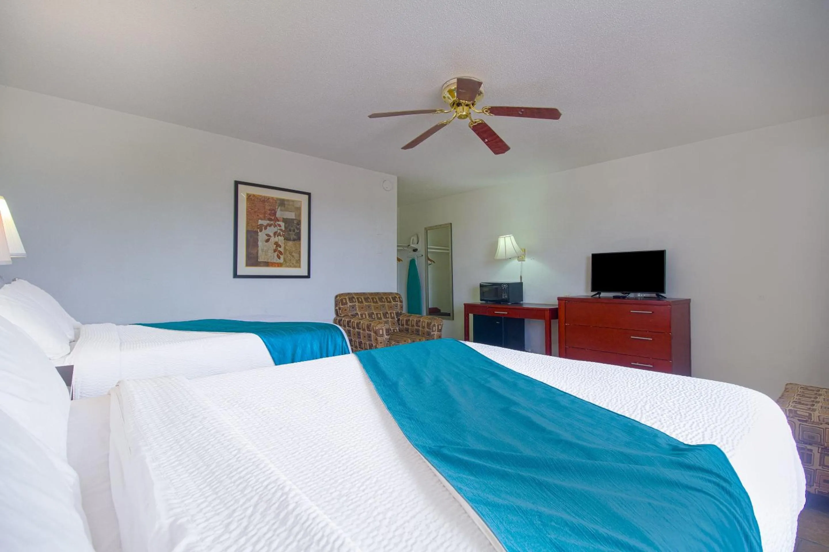 Bedroom in American Best Inn By OYO I-35 Perry near Lake McMurtry