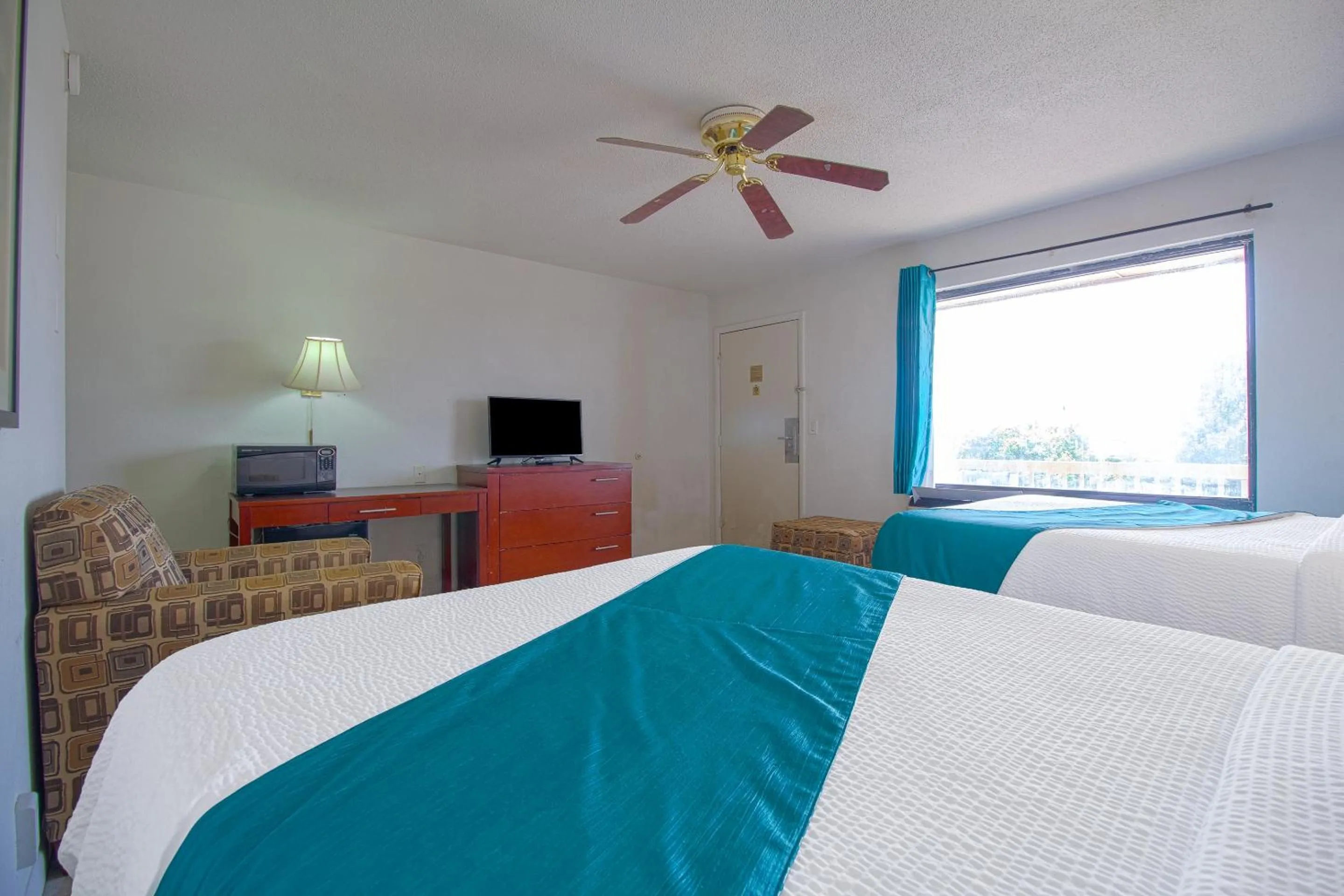 Bedroom in American Best Inn By OYO I-35 Perry near Lake McMurtry