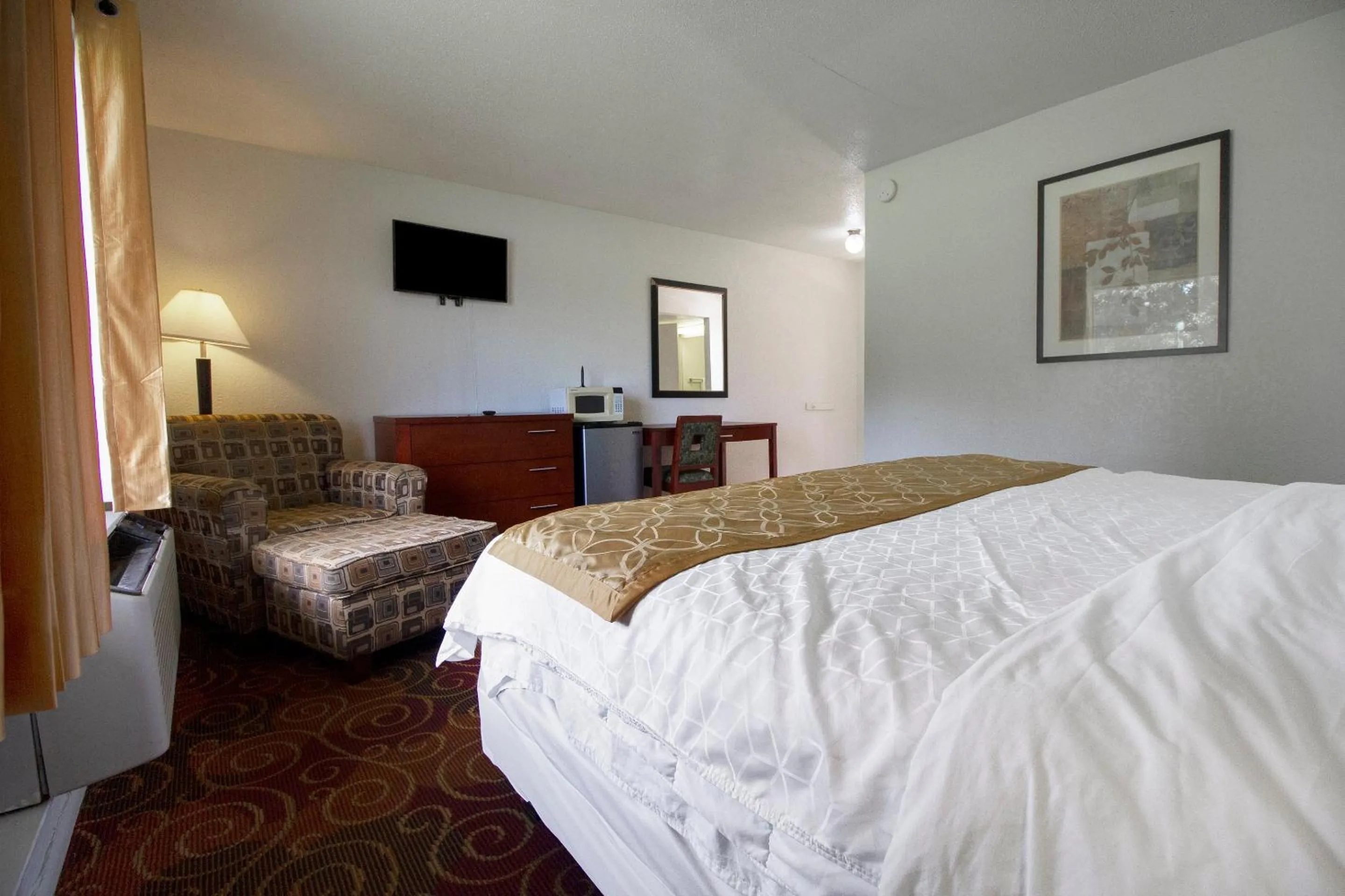 Bedroom in American Best Inn By OYO I-35 Perry near Lake McMurtry