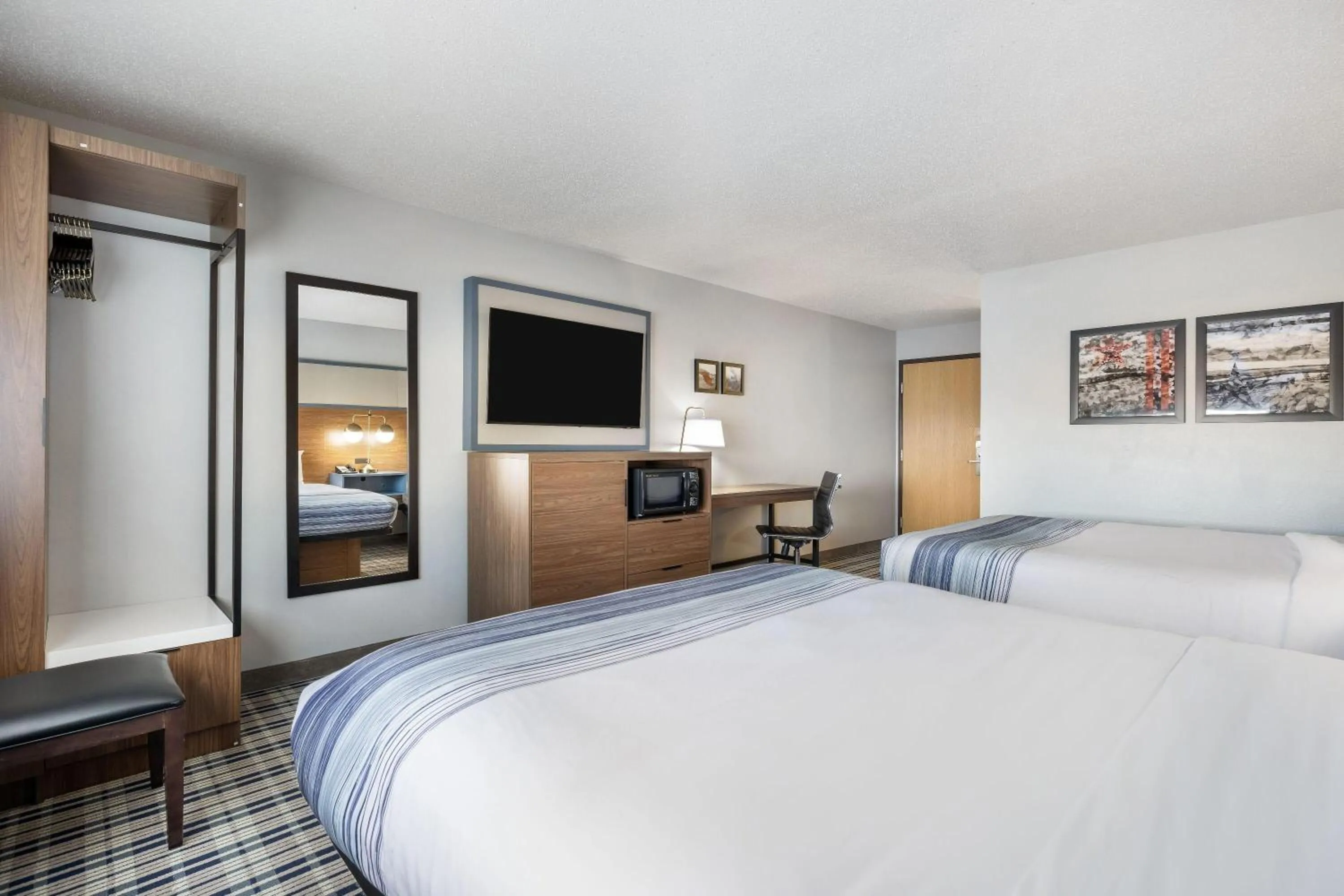 Bed in AmericInn by Wyndham Aberdeen Event Center