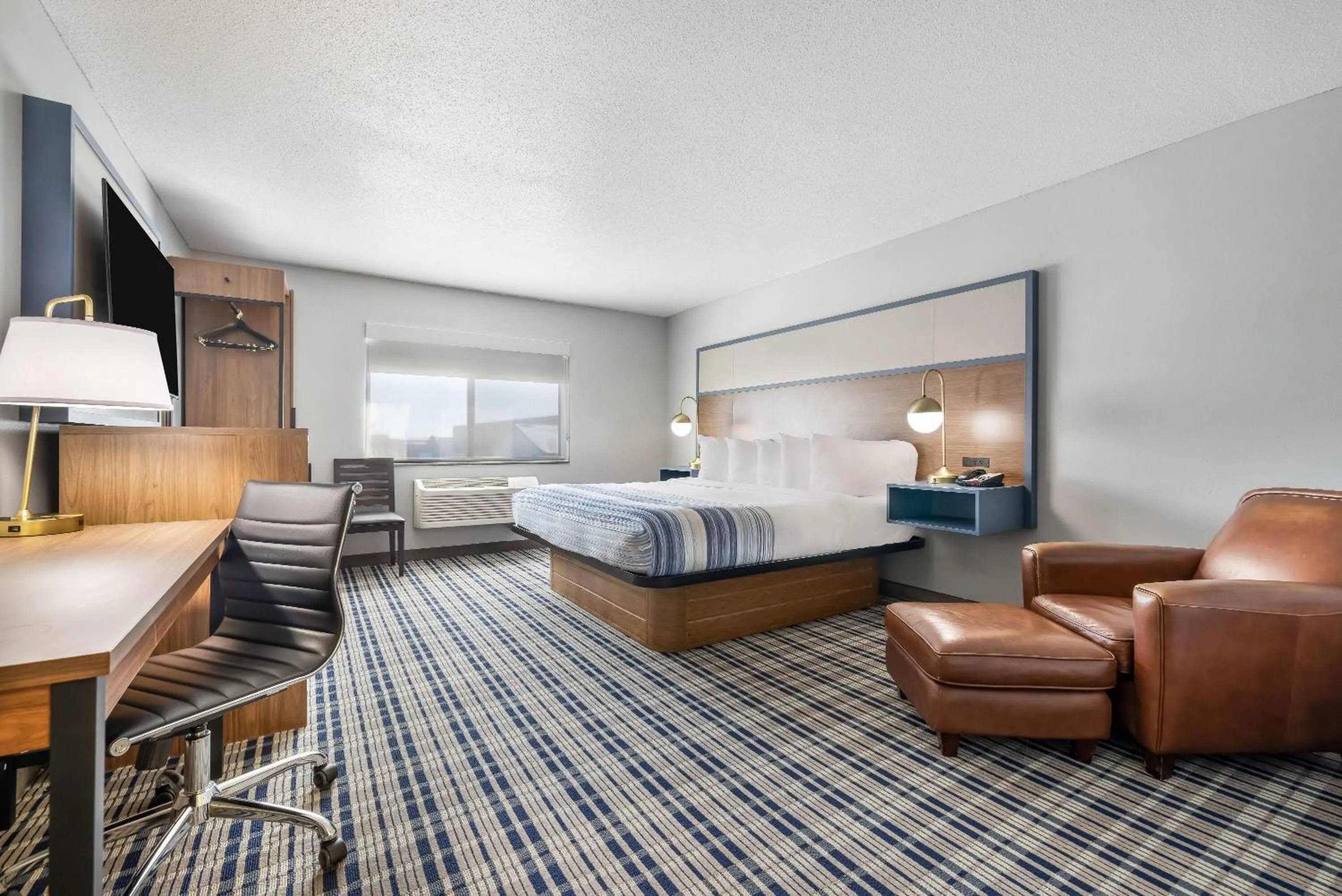 Bed in AmericInn by Wyndham Aberdeen Event Center