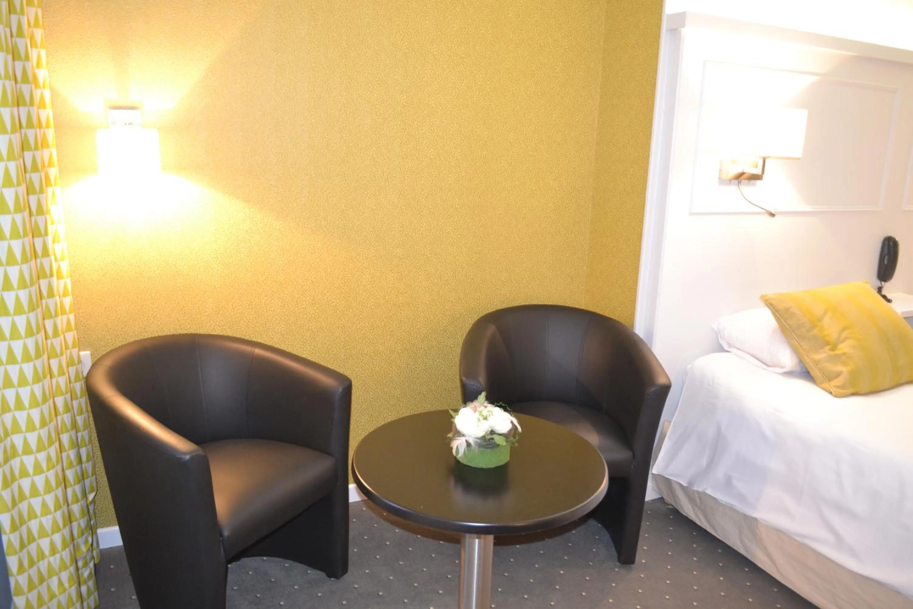 Seating area, Bed in Logis Hôtel & Restaurant - Les Hauts de Montreuil