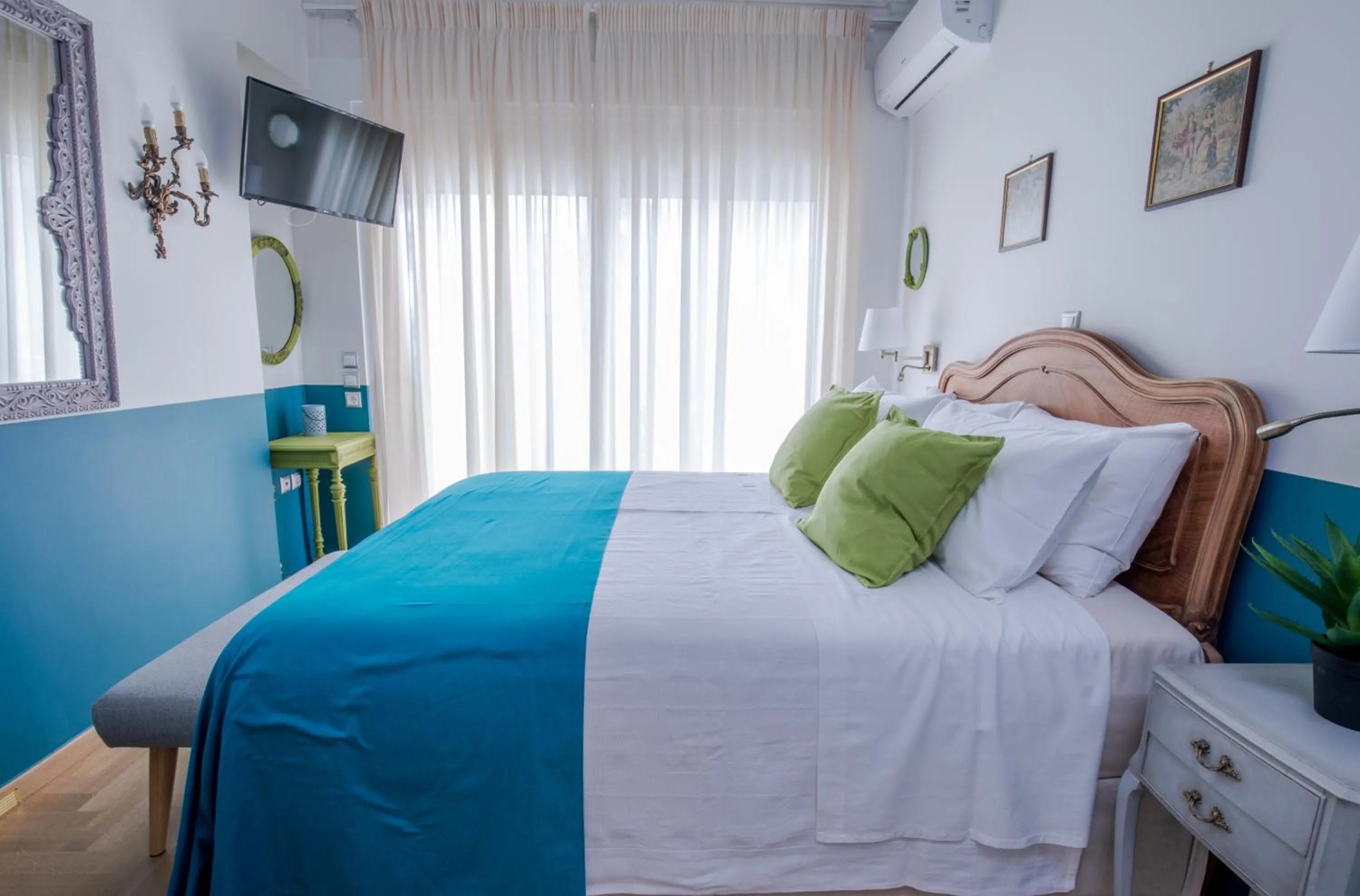 Bed in Rastoni Athens Suites near Acropolis at Tsatsou street