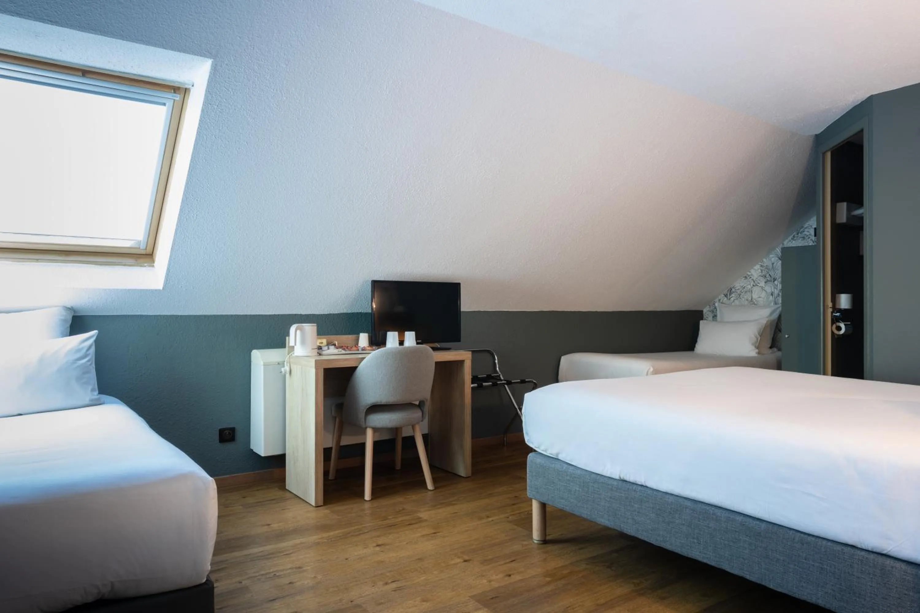 Photo of the whole room, Bed in Kyriad Beaune