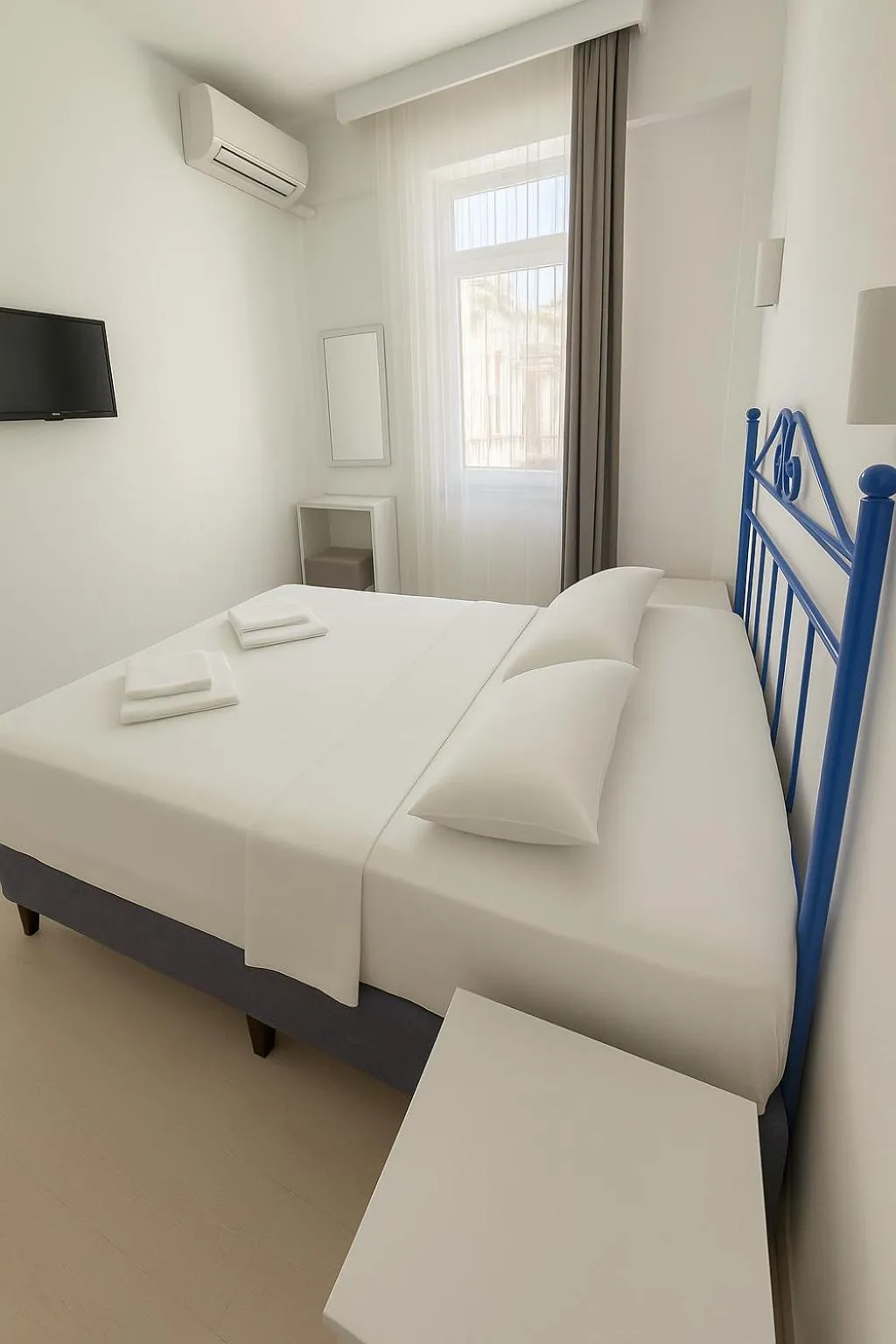 Bed in R HOUSE HOTEL