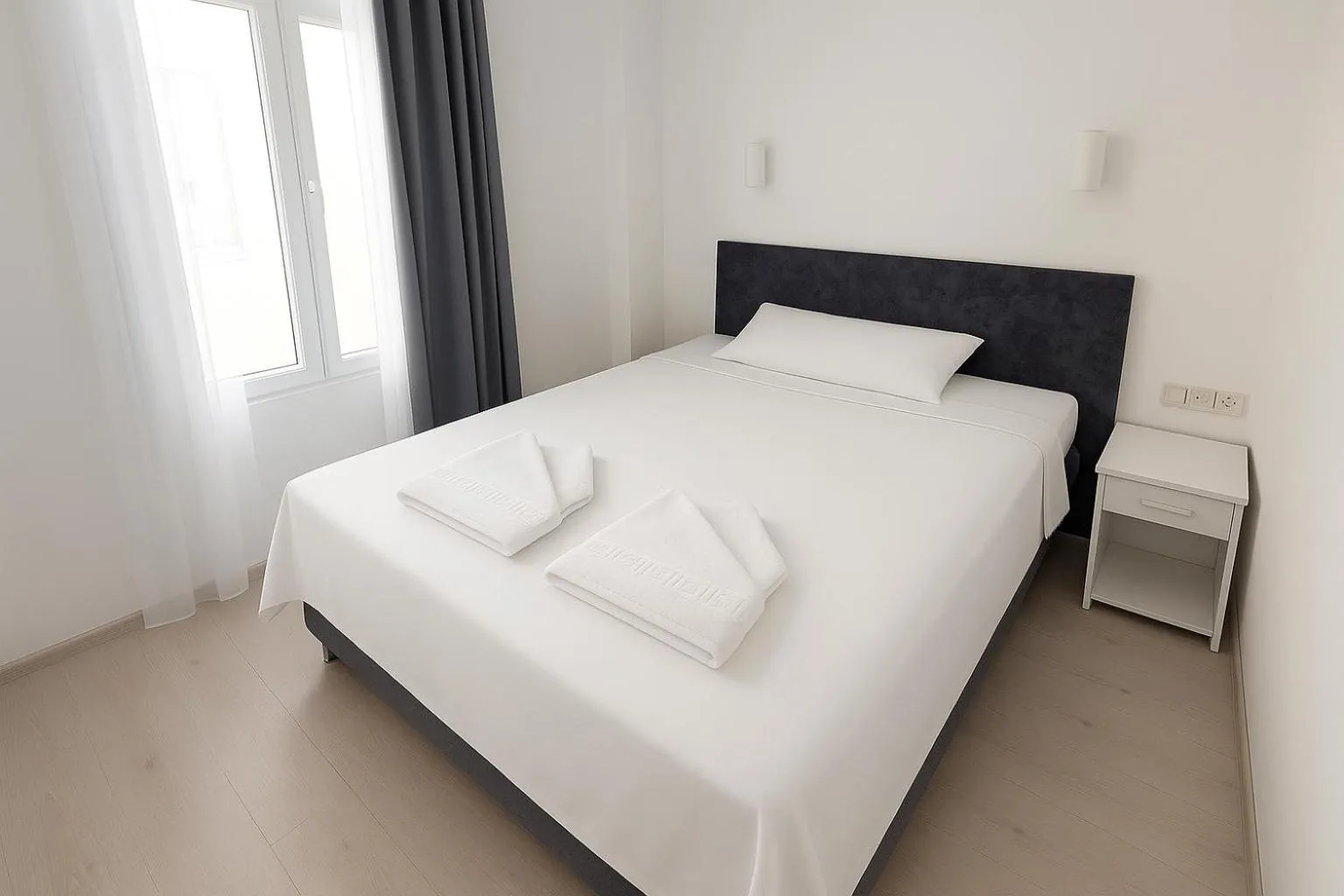 Bed in R HOUSE HOTEL