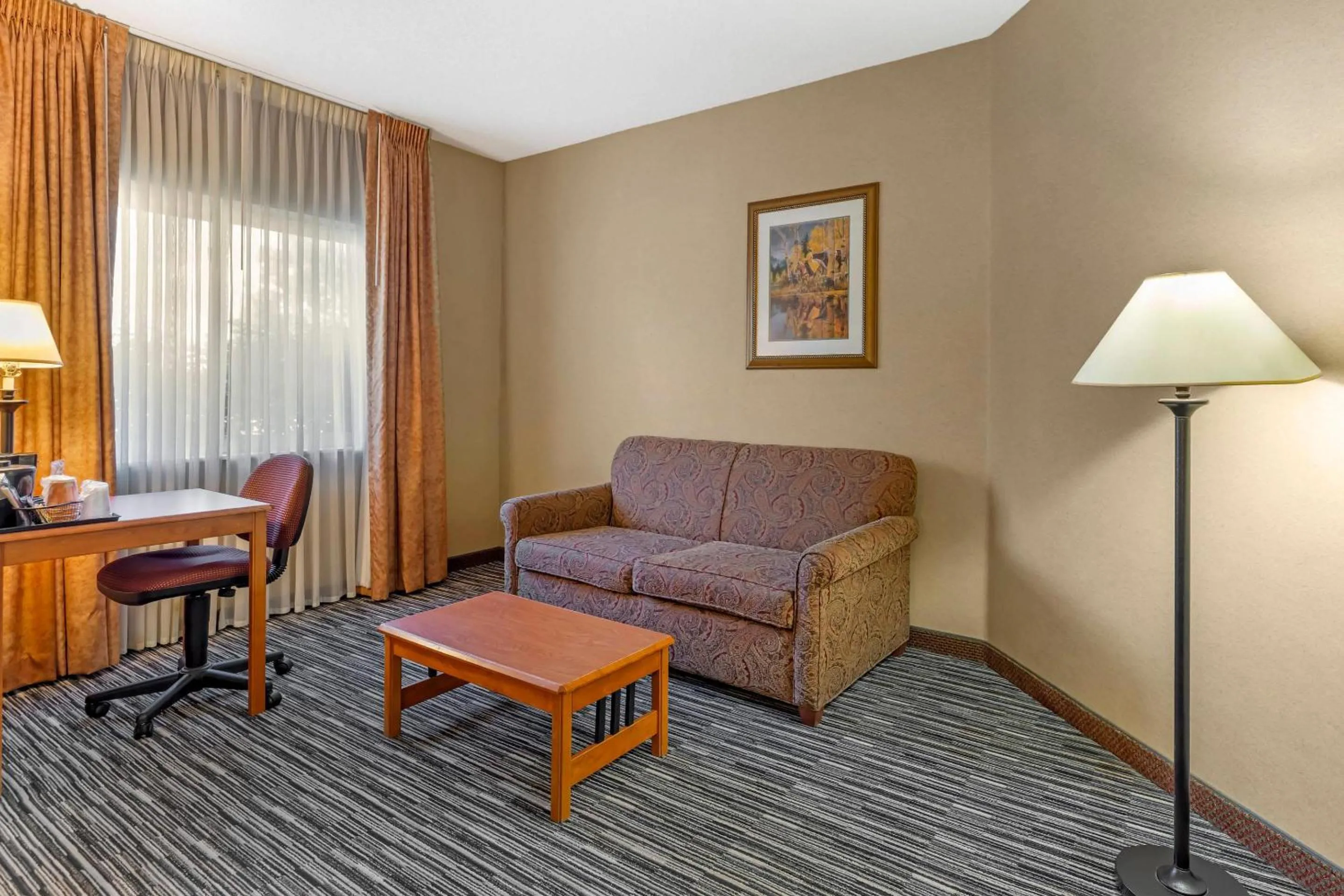 Bedroom in Quality Inn & Suites Wellington - Fort Collins