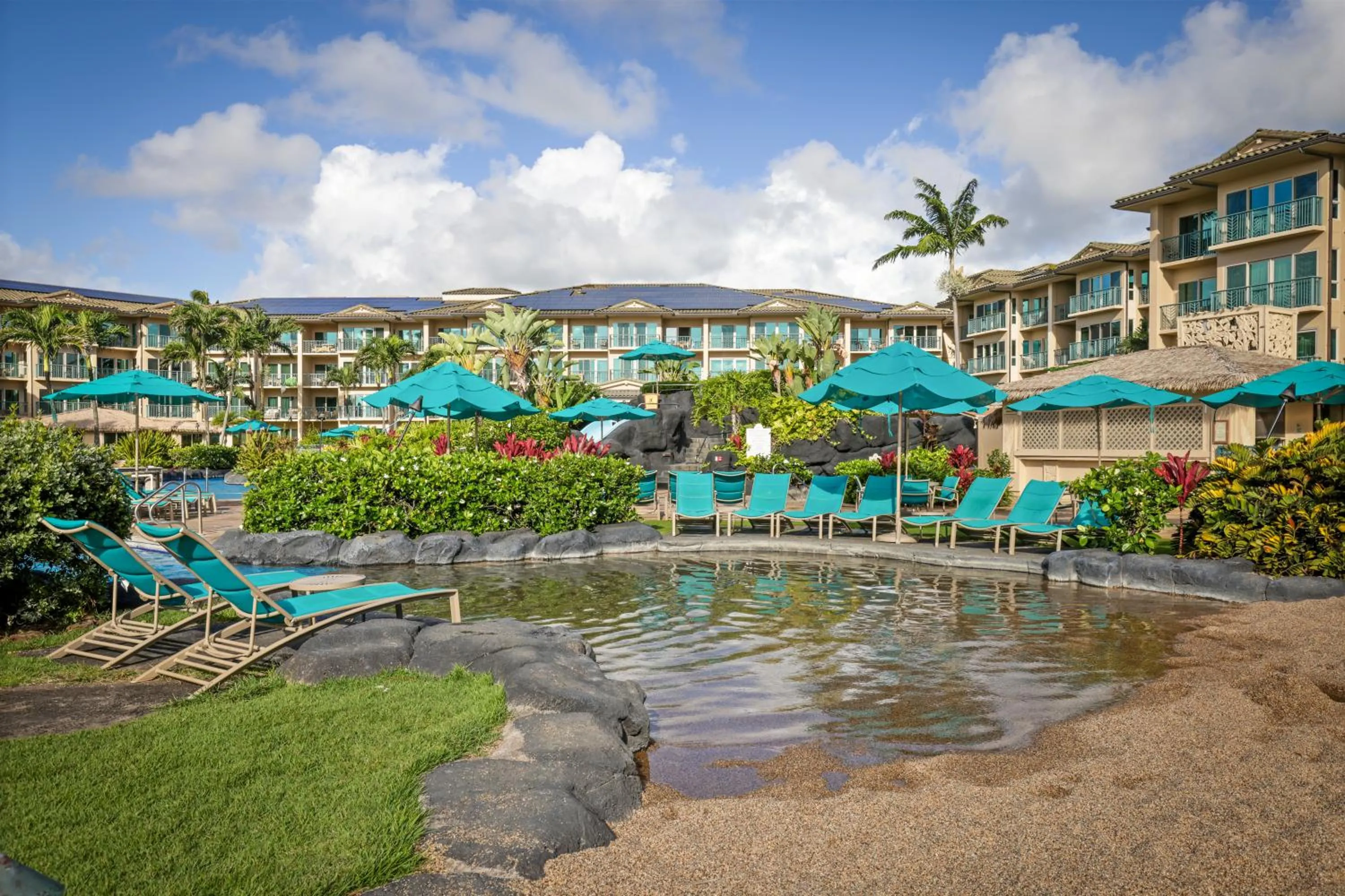 Swimming pool in Waipouli Beach Resort and Spa Kauai by OUTRIGGER