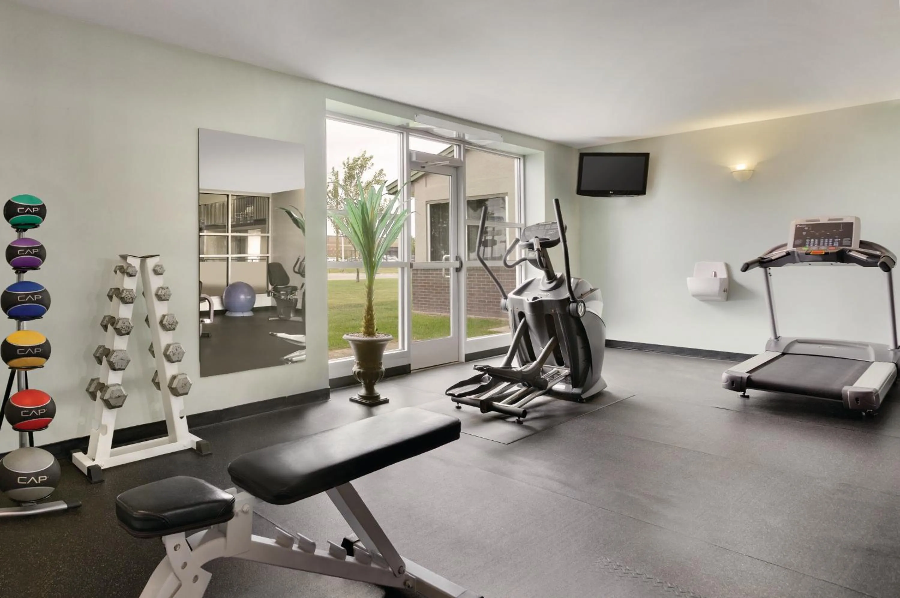Fitness centre/facilities in Country Inn & Suites by Radisson, Fergus Falls, MN