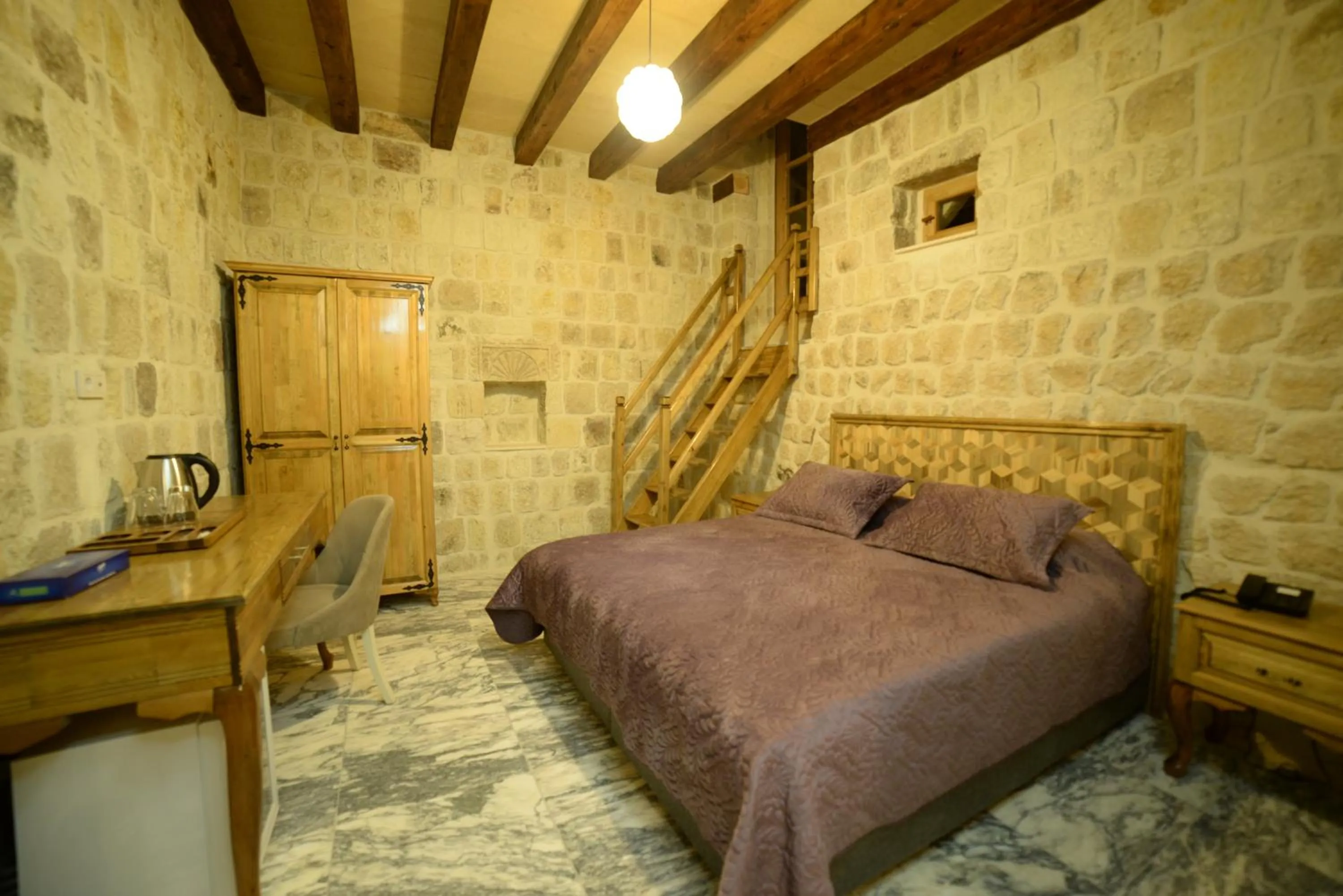 Bed in Crassus Cave Hotel