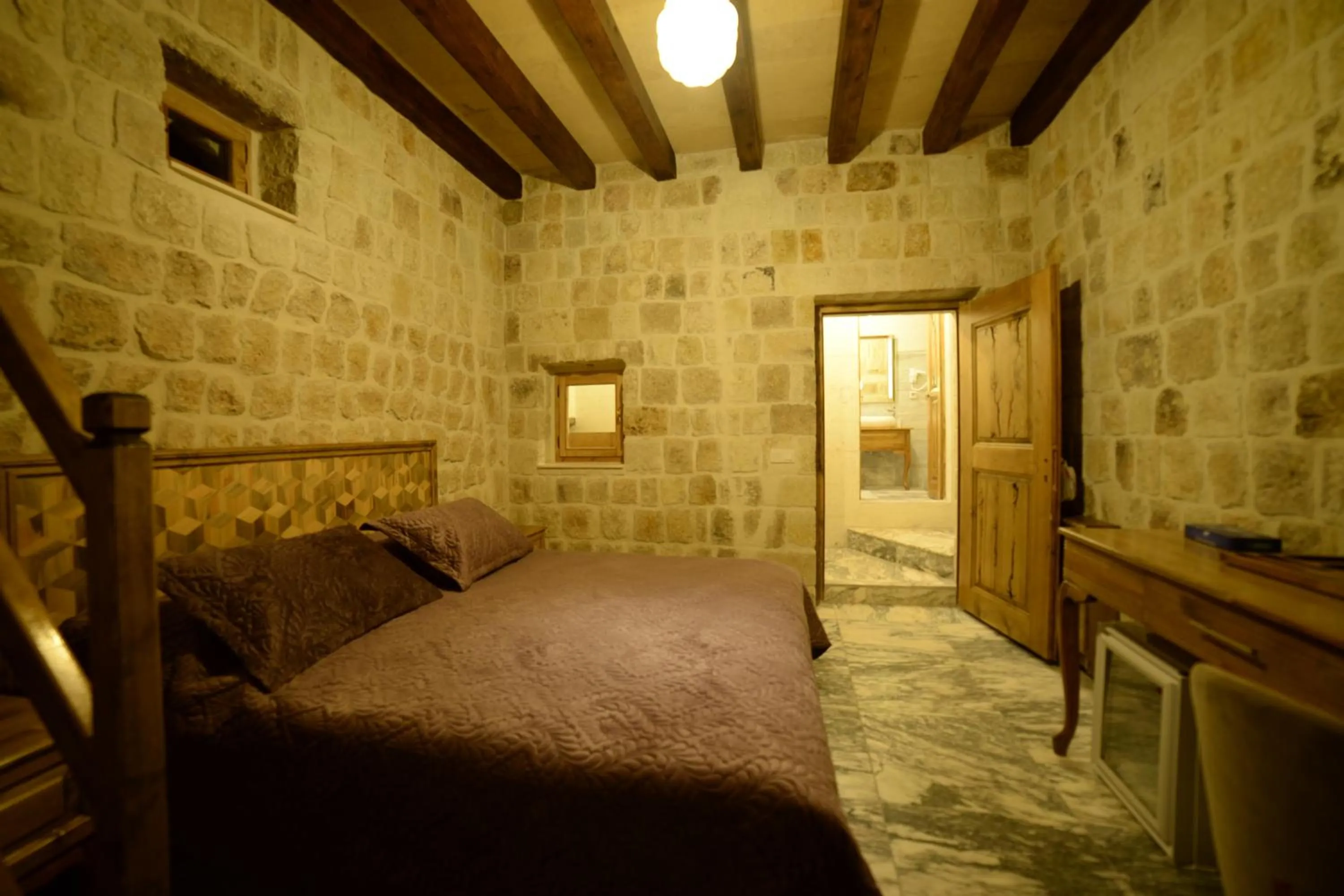 Bed in Crassus Cave Hotel