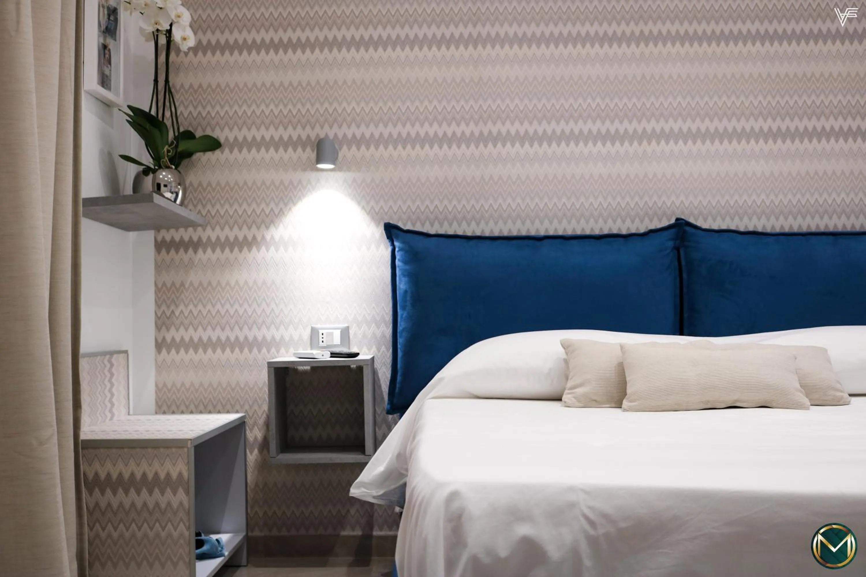Bed in MARGHERITA BOUTIQUE ROOMS