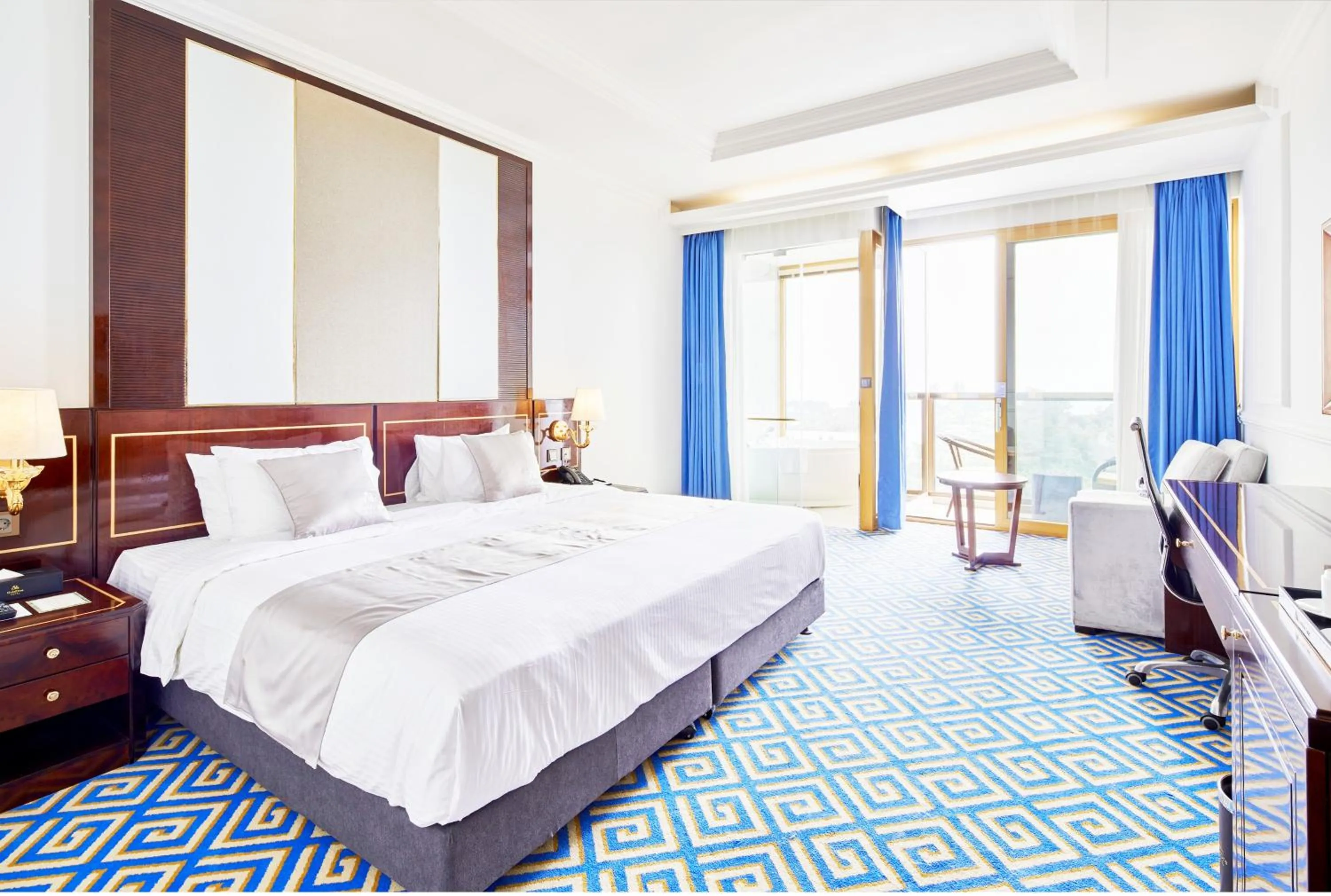 Bed in GoldOne Hotel & Suites