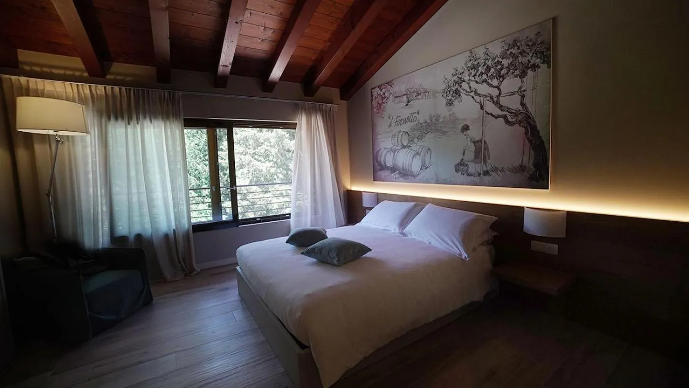 Bed in AGRITURISMO ACINATICO WINE RELAIS