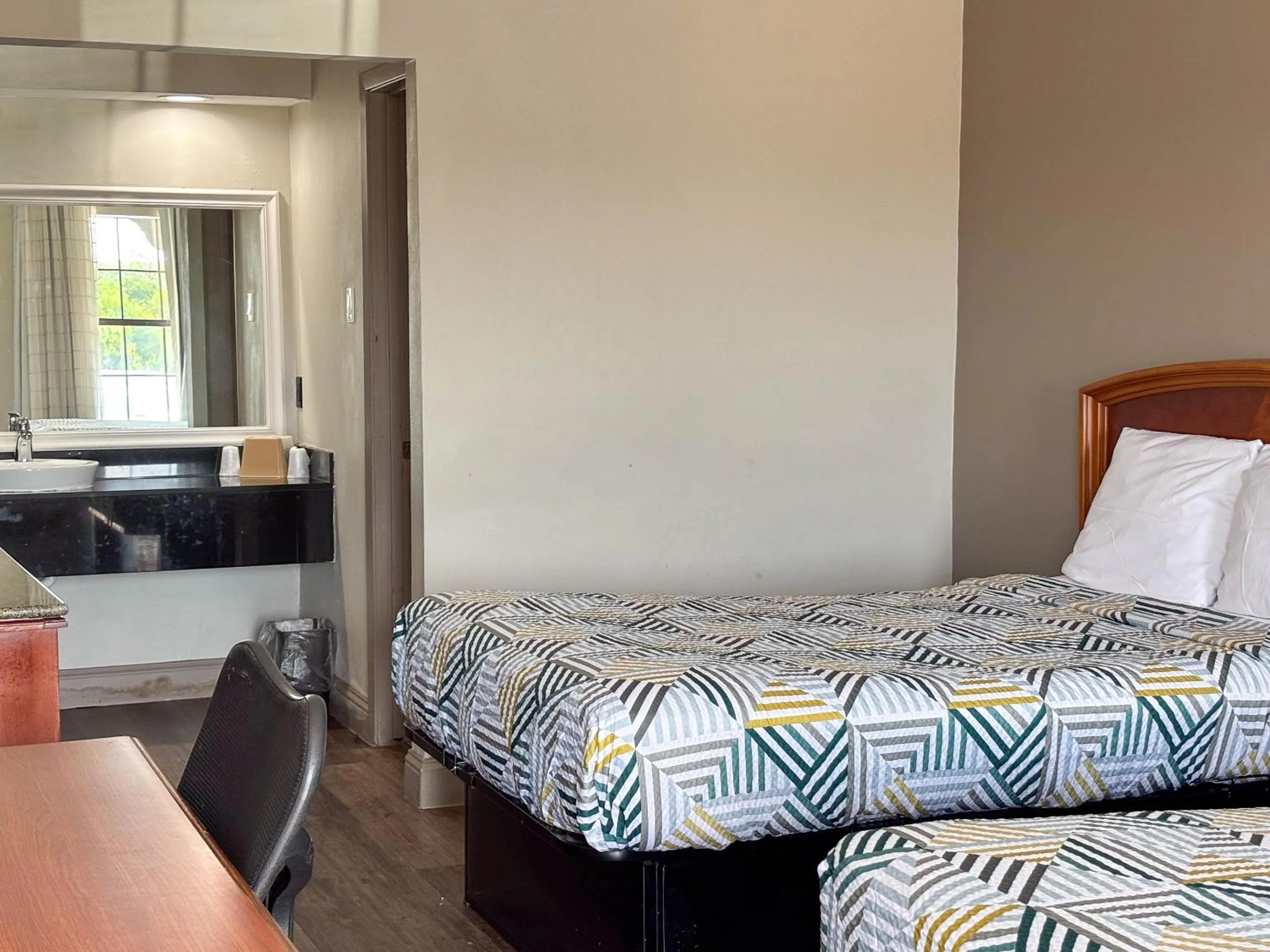 Bed in Studio 6 Suites Mesquite, TX – Gross Rd.