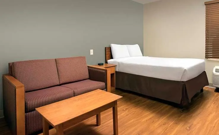 Bed in WoodSpring Suites Lincoln Northeast I-80