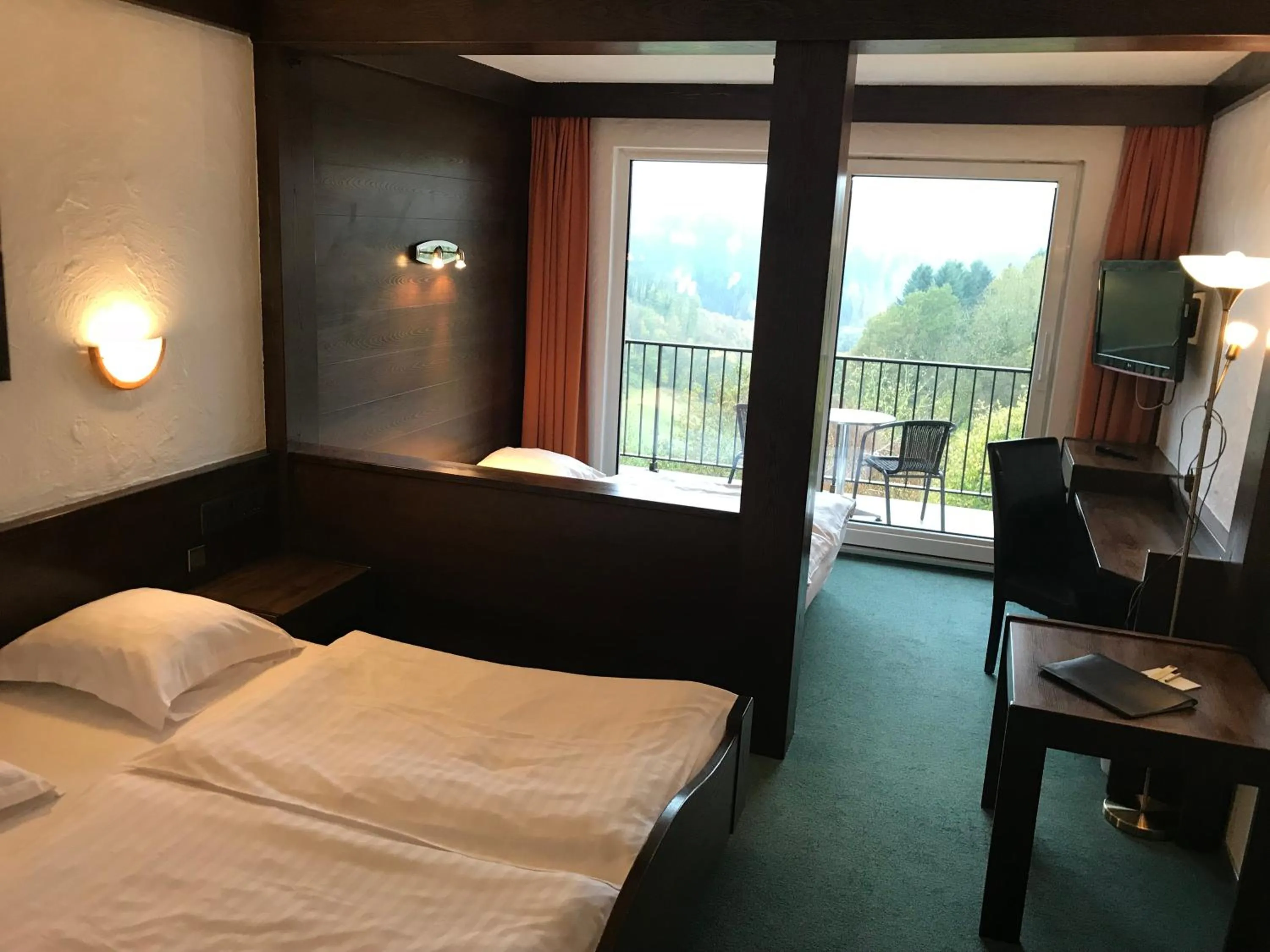 Photo of the whole room, Bed in Logis Hôtel-Restaurant Aux Trois Roses