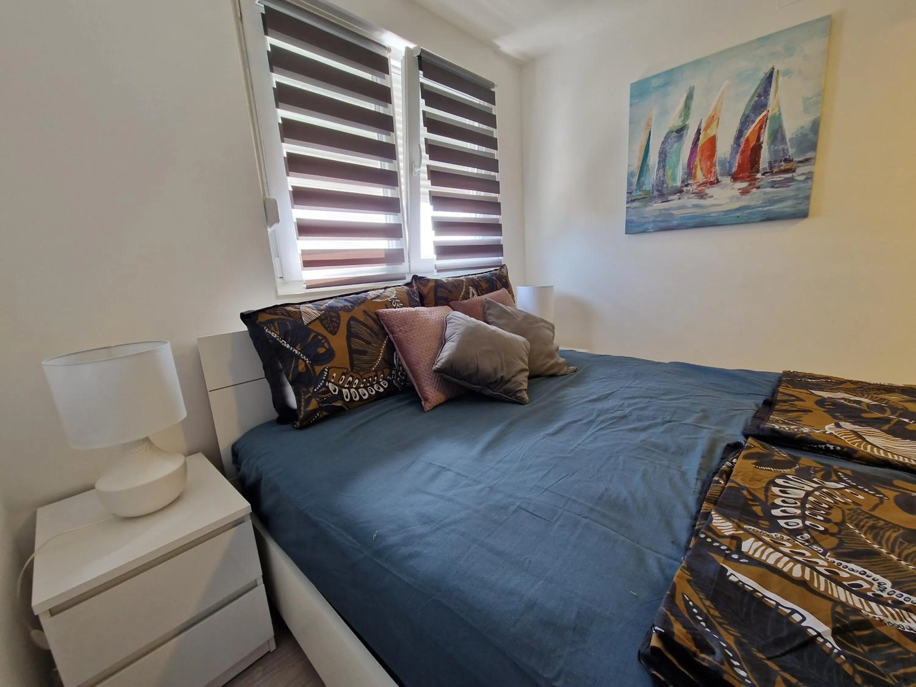 Bed in Apartments Mak & Lux - sea & sunset top view