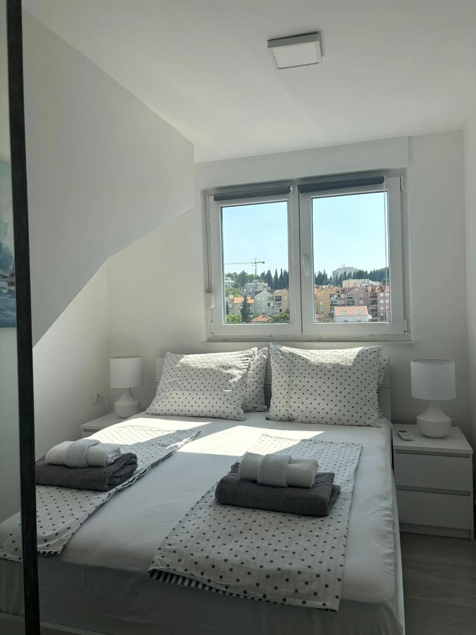 Bed in Apartments Mak & Lux - sea & sunset top view