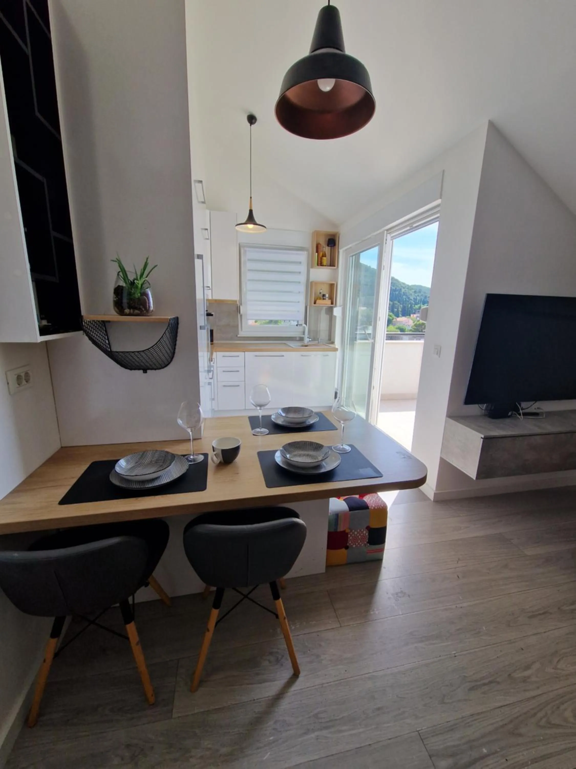 Dining area in Apartments Mak & Lux - sea & sunset top view