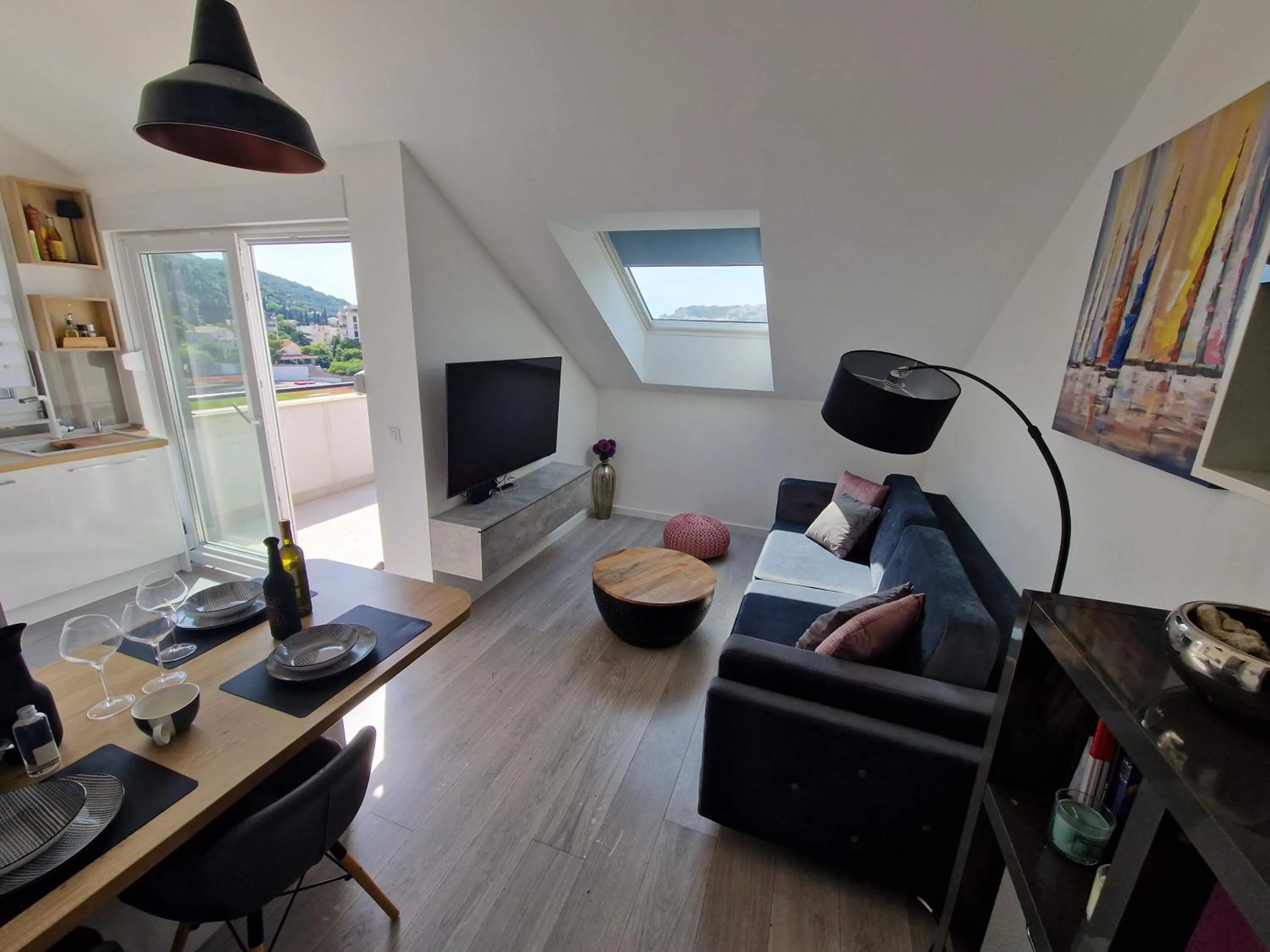 Living room in Apartments Mak & Lux - sea & sunset top view