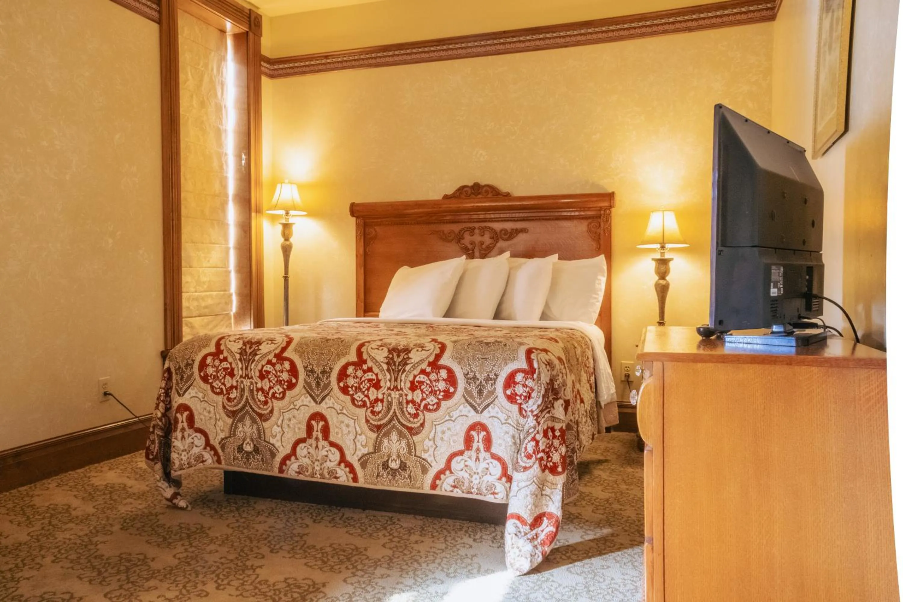 Bed in Historic Bullock Hotel