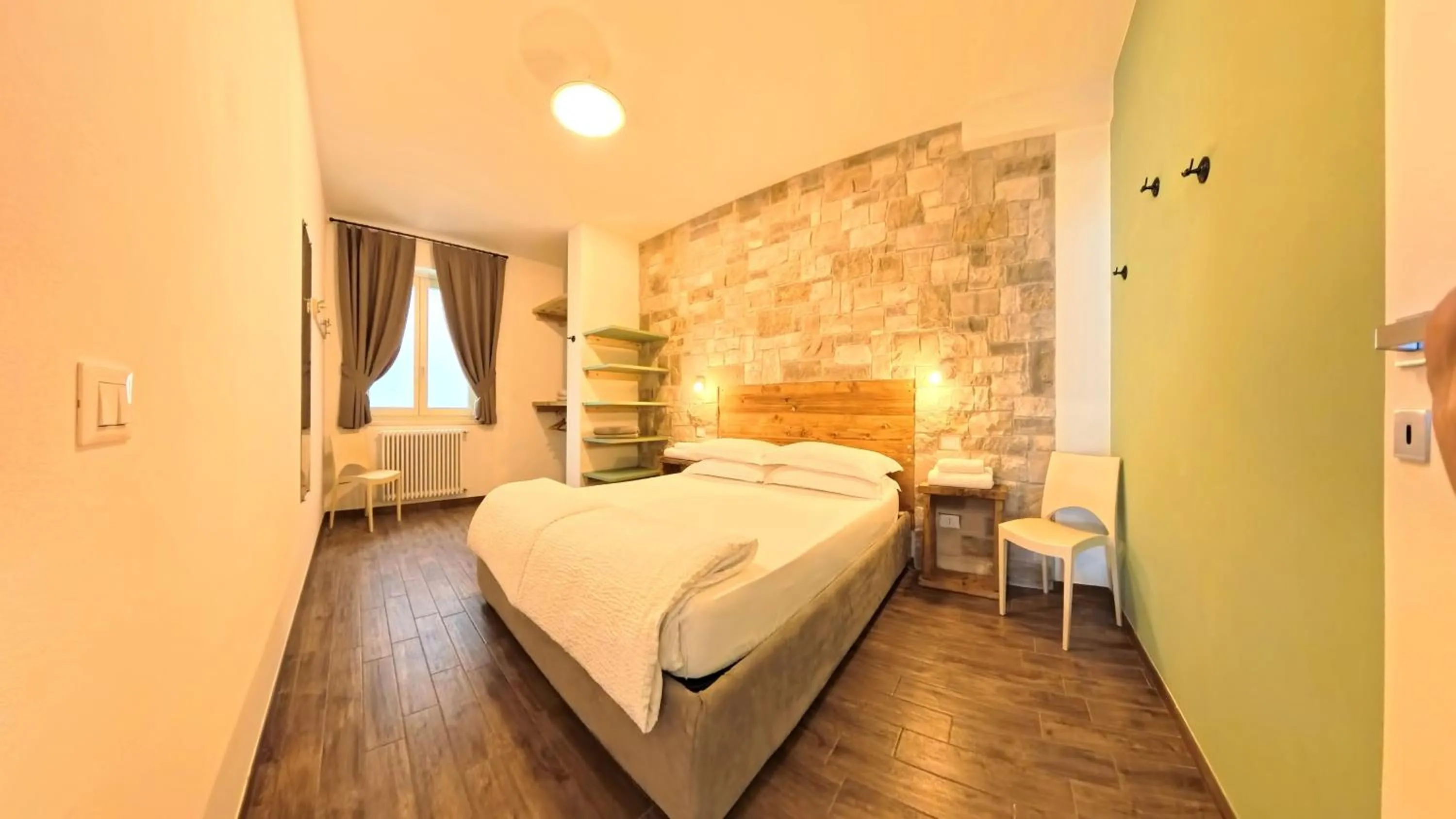 Bed in Oasi Da Vinci Apartments Lake Garda View