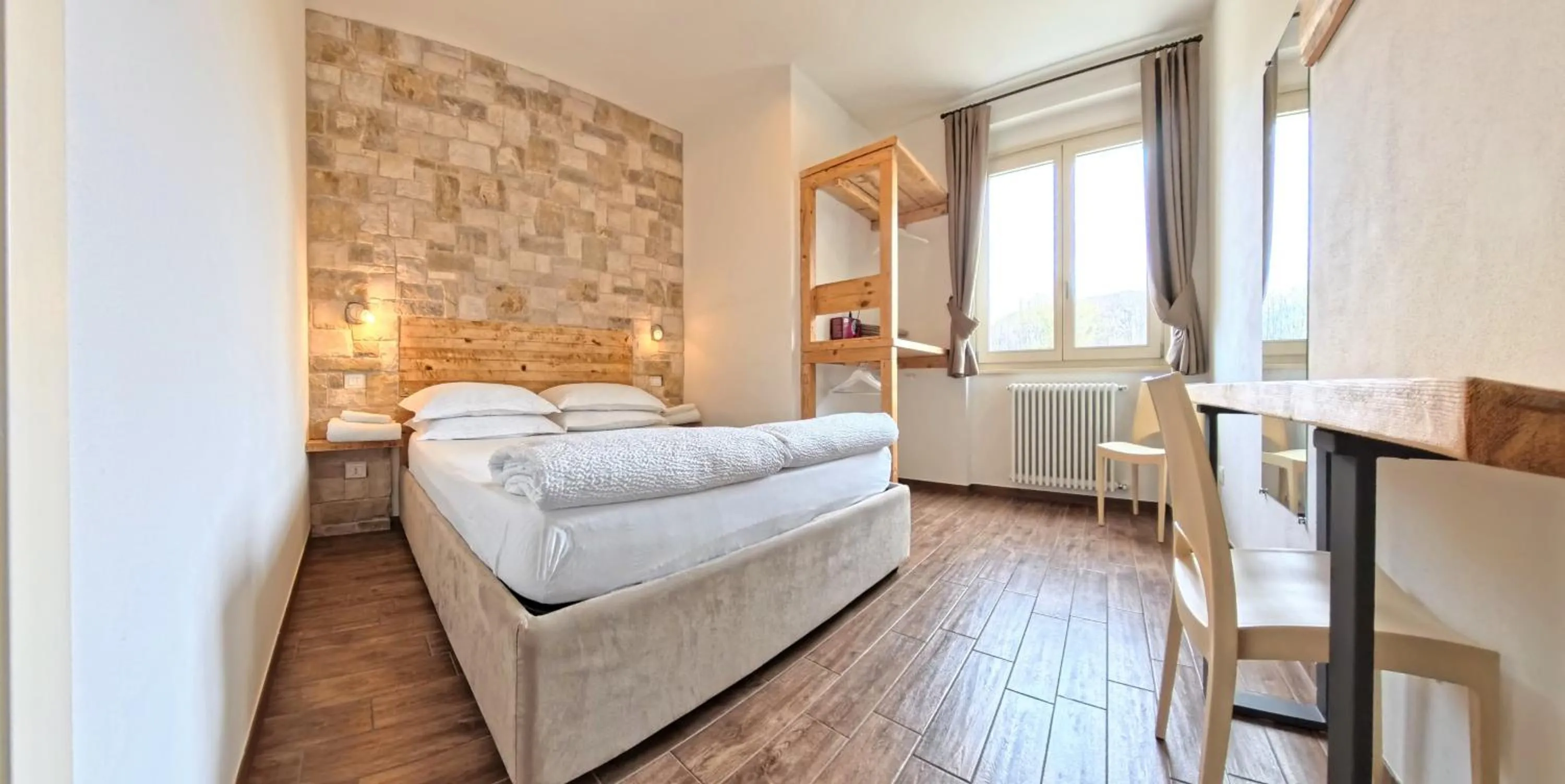 Bed in Oasi Da Vinci Apartments Lake Garda View