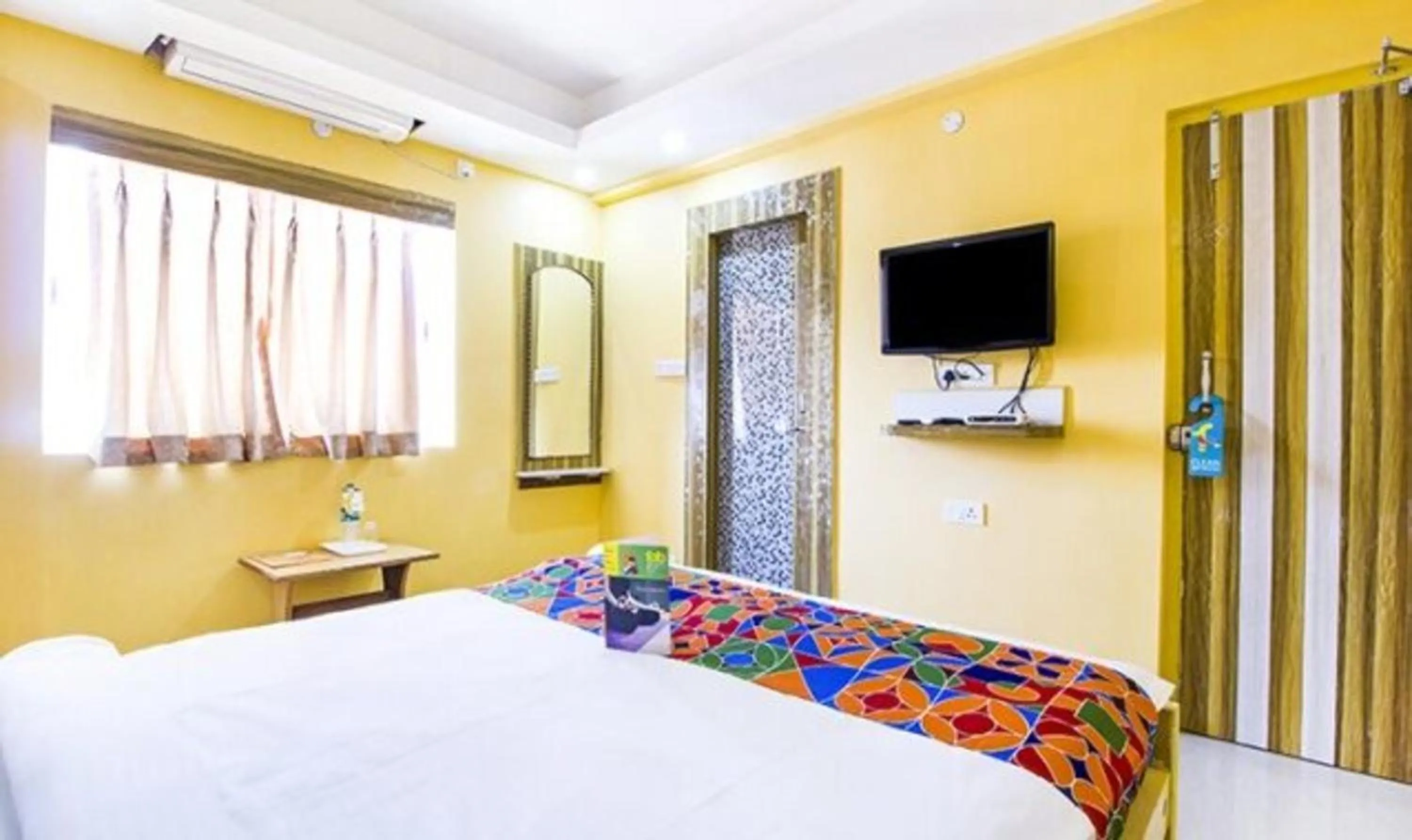 Bed in FabHotel Amaltas