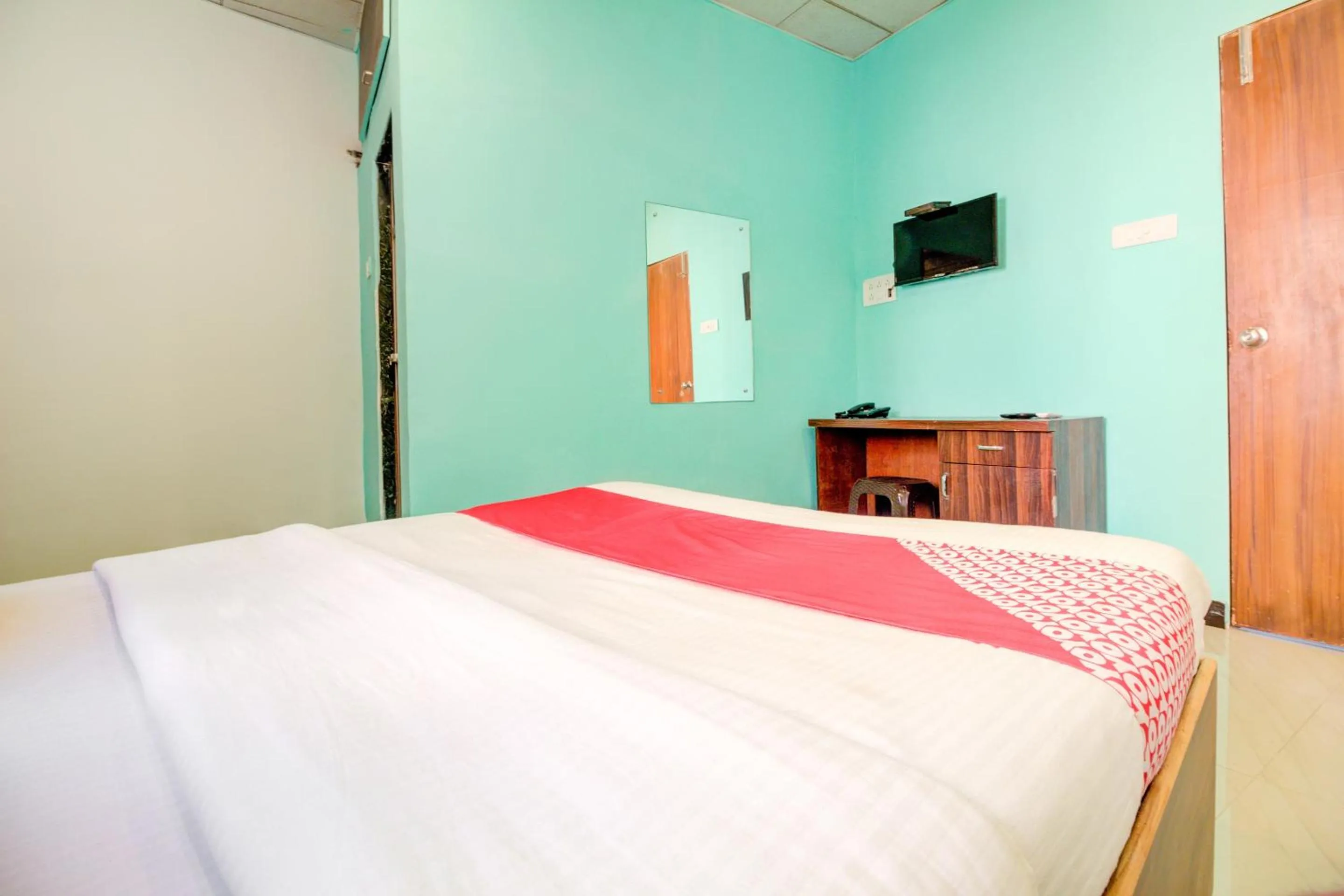 Bedroom, Bed in Super Hotel O Anjali Hotel