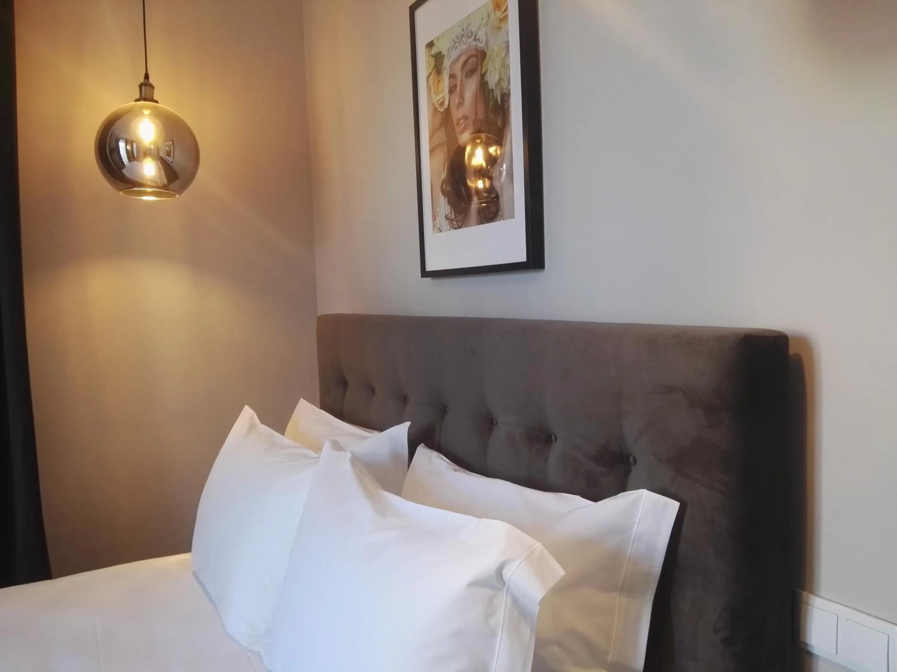 Bed in Temple Suites Guesthouse