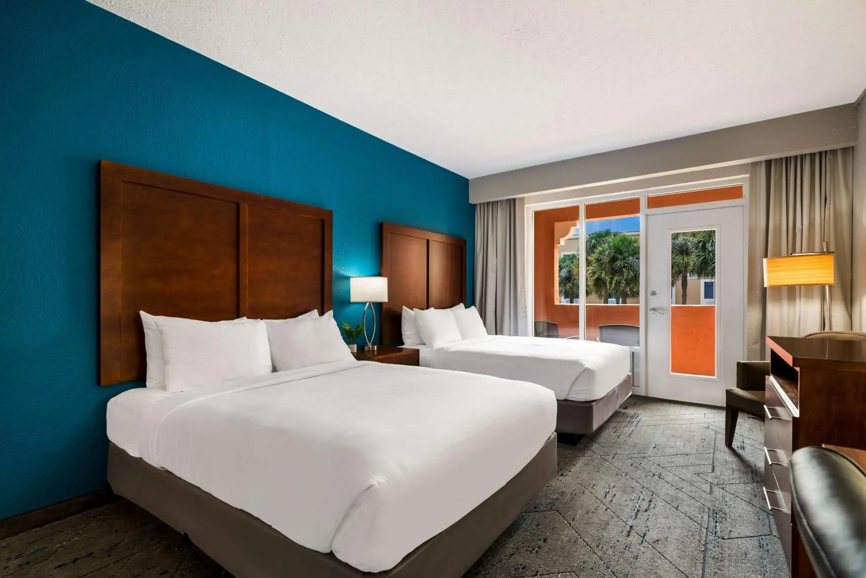 Queen Room with Two Queen Beds and Patio - First Floor in SureStay Plus Hotel by Best Western The Villages Queen Room with Two Queen Beds and Patio - First Floor in SureStay Plus Hotel by Best Western The Villages