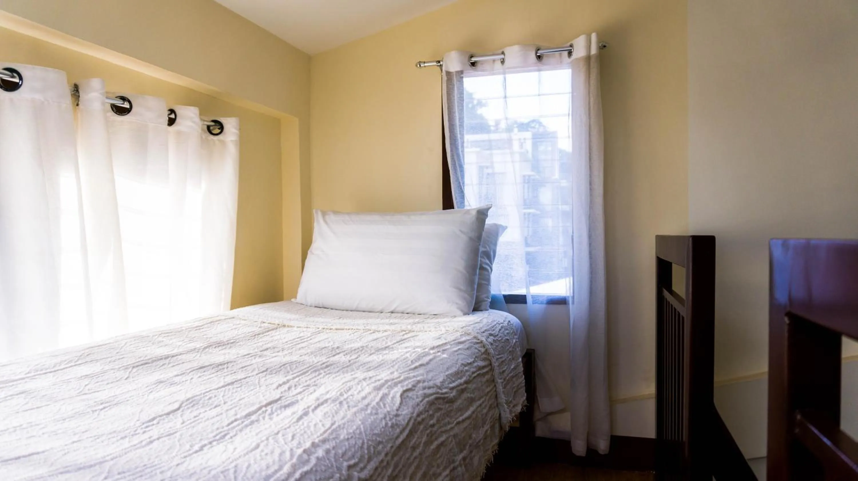 Bed in Talisay Boutique Hotel