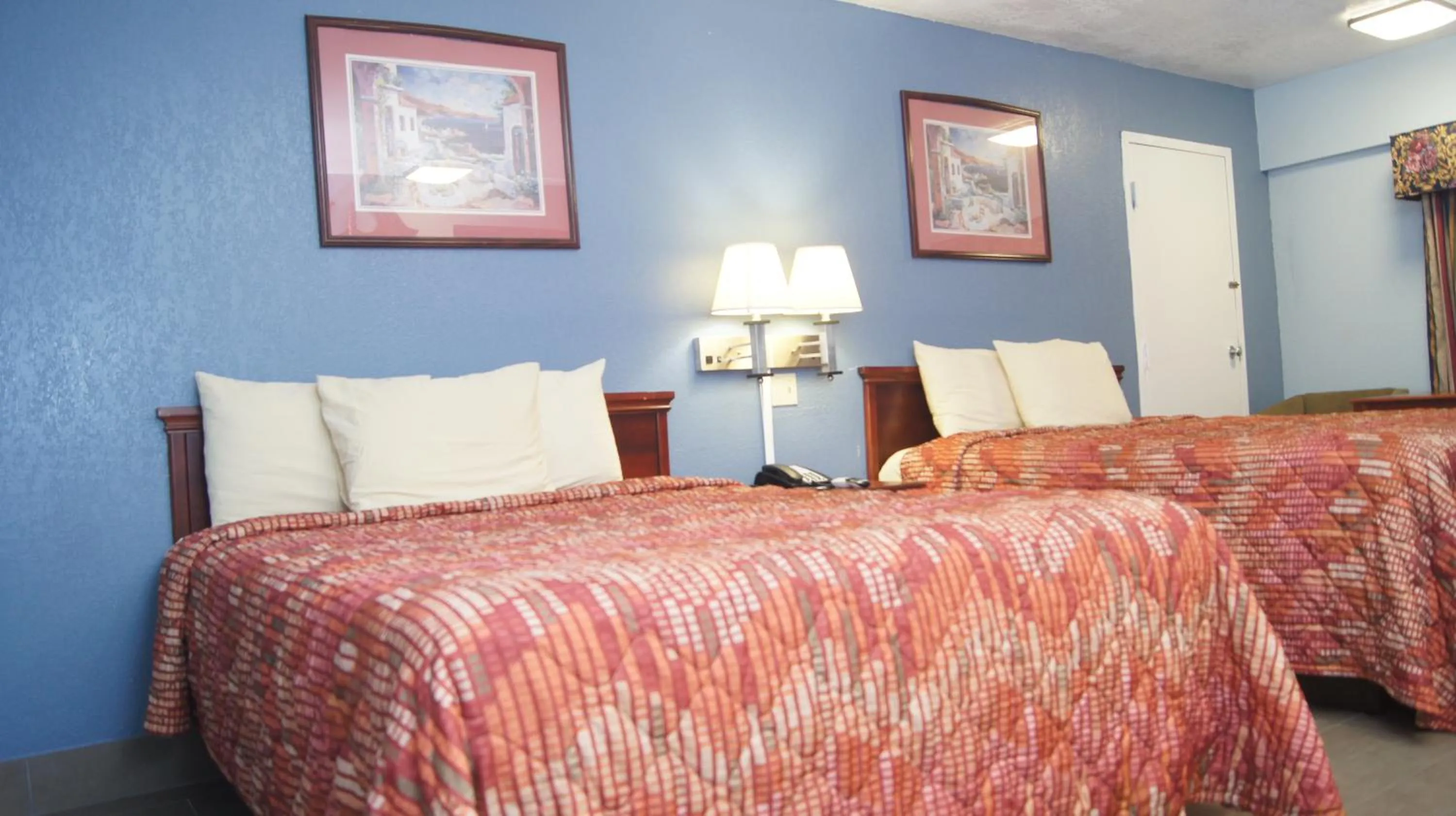 Bedroom in Holiday Lodge & Suites